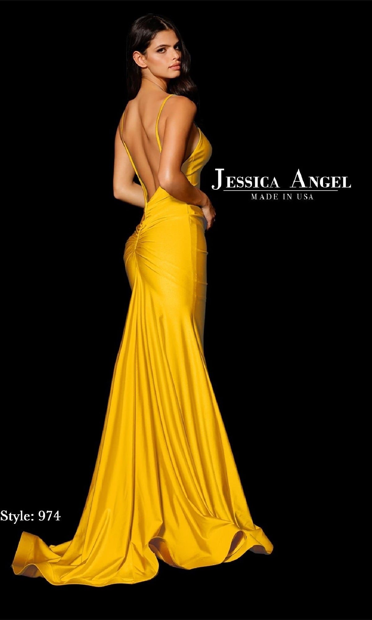 A woman poses with her back to the camera in a bright yellow, floor-length Jessica Angel 974 prom dress featuring an open back, thin straps, and a mermaid skirt. “Jessica Angel” and “Style: 974” appear on a black background.