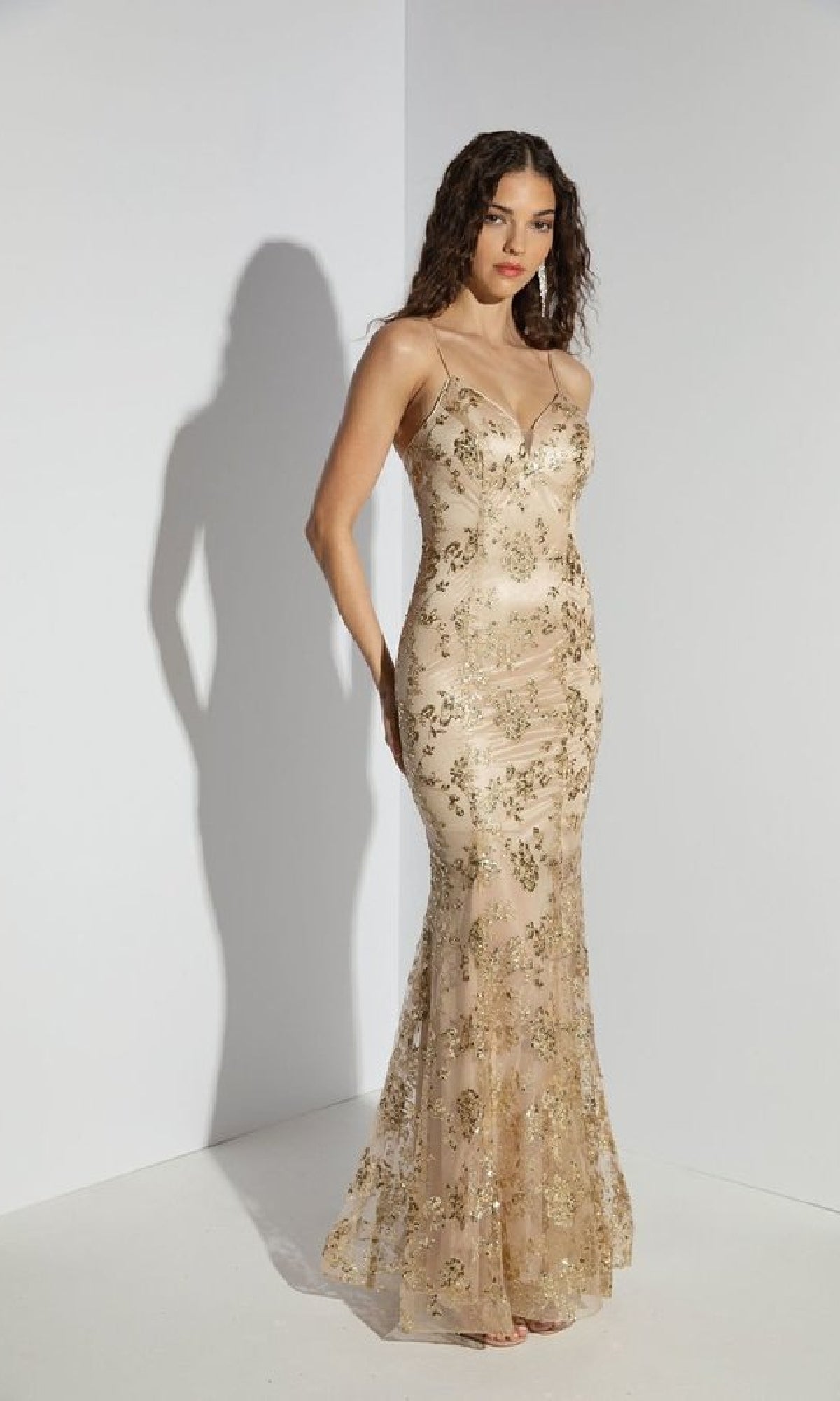Woman wearing the Strapless Long Glitter-Print Prom Dress: Eureka 9788, a fitted, shimmering mermaid gown, standing against a plain white background.