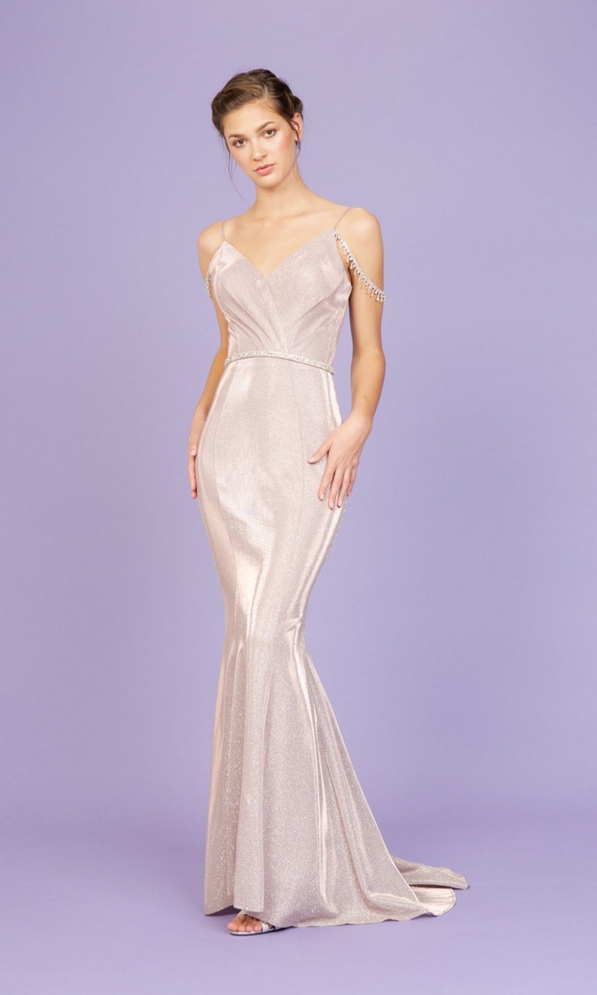 A woman models the Long Prom Dress: Eureka 9811, a sparkly mermaid gown with thin straps and beading, against a plain lavender background.