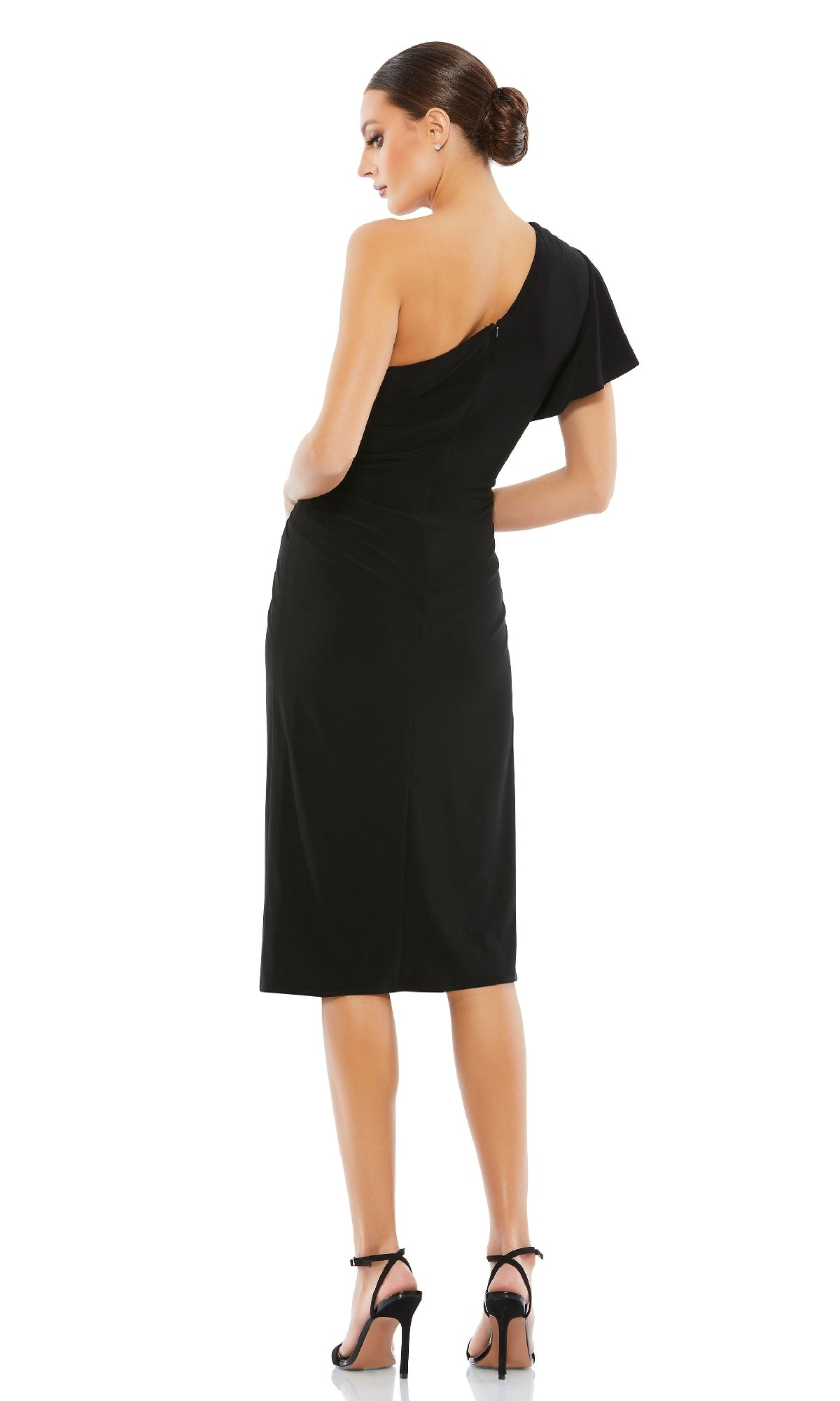 A woman stands with her back to the camera, wearing the black One-Shoulder Knot-Waist Midi Party Dress 12480 and black high-heeled sandals, perfect for cocktail parties, against a white background.