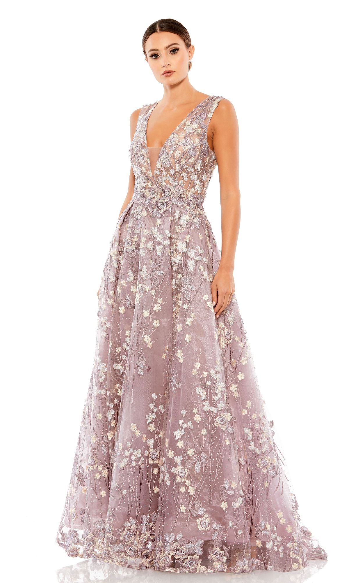 A woman wears the Mac Duggal A20131 Embroidered Long Formal Dress, a sleeveless lavender A-line evening gown with floral embroidery and a deep V-neckline, posing against a plain white background.