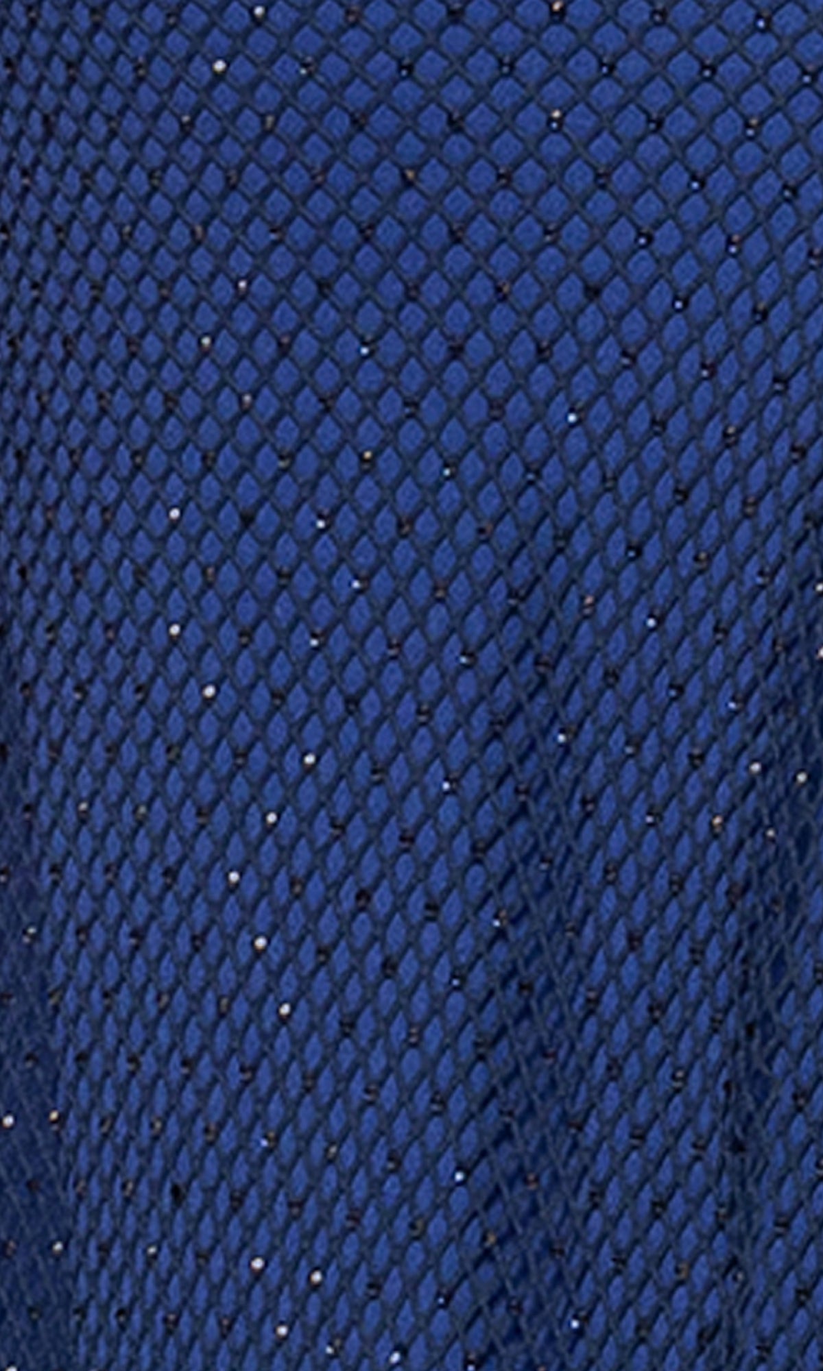 Close-up of the Long Formal Dress: Betsy and Adam A26963 in navy blue, featuring diamond-patterned mesh fabric with small, scattered glitter-like specks.