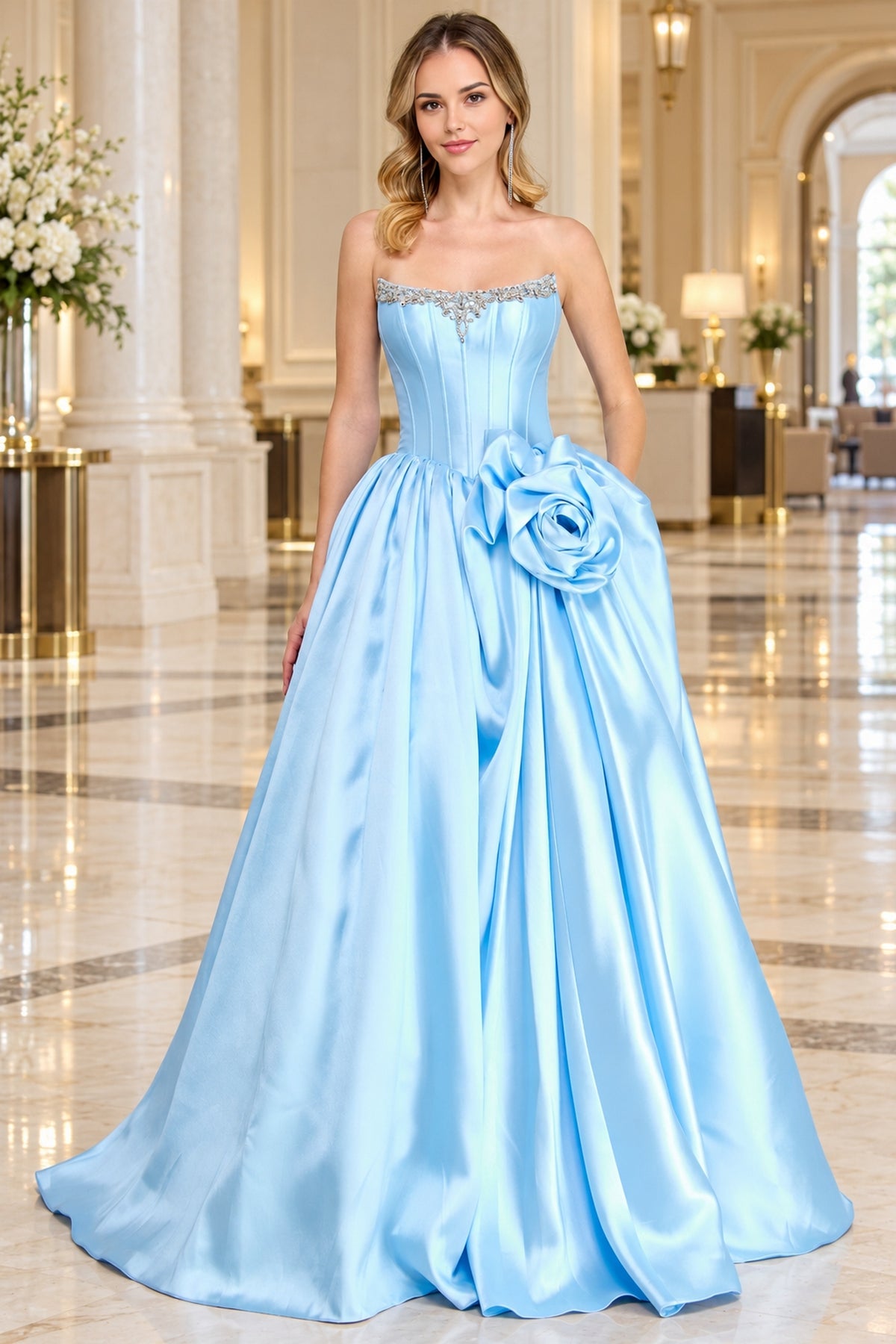 Light blue strapless Amelia Couture AL1401 corset prom ball gown featuring a beaded bodice and a large fabric flower accent on the skirt.