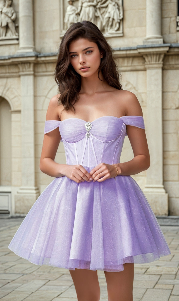 A young woman poses outside a stone building in the Off-Shoulder Short Fit-and-Flare Hoco Dress 3394, featuring a corset-style bodice and tulle skirt.