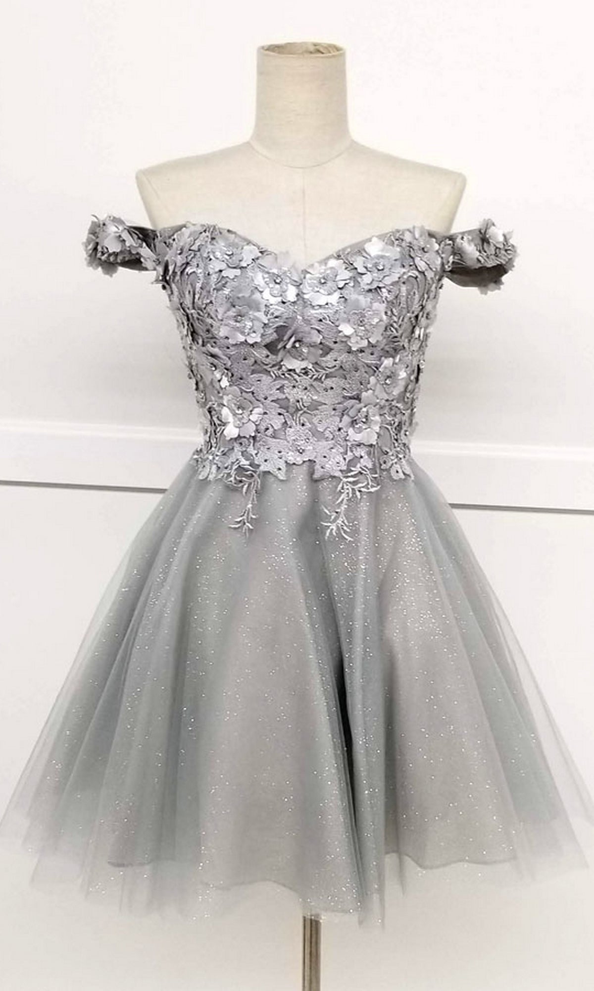 Beaded-Bodice Short A-Line Homecoming Dress C315: off-the-shoulder semi-formal babydoll dress with a silver floral lace beaded bodice and tulle skirt, shown on a dress form.
