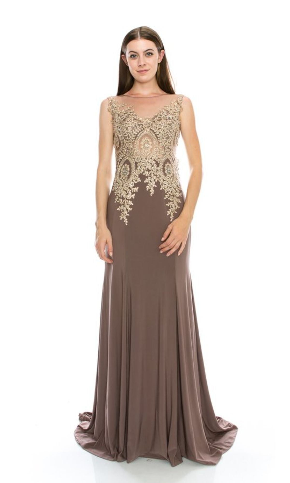 A woman stands against a plain white background, wearing the Chicas C4233 Gold-Embroidered Long Prom Dress—a sleeveless, floor-length taupe gown with intricate gold embroidery on the bodice.
