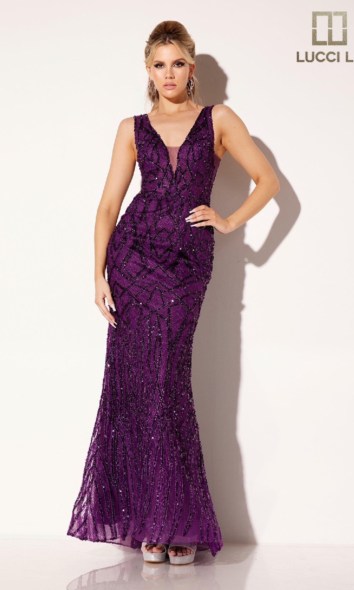 A woman poses against a white background in the Lucci Lu C8109, a sleeveless deep purple floor-length formal dress with a V-neckline. The Lucci Lu logo is displayed in the upper right corner.