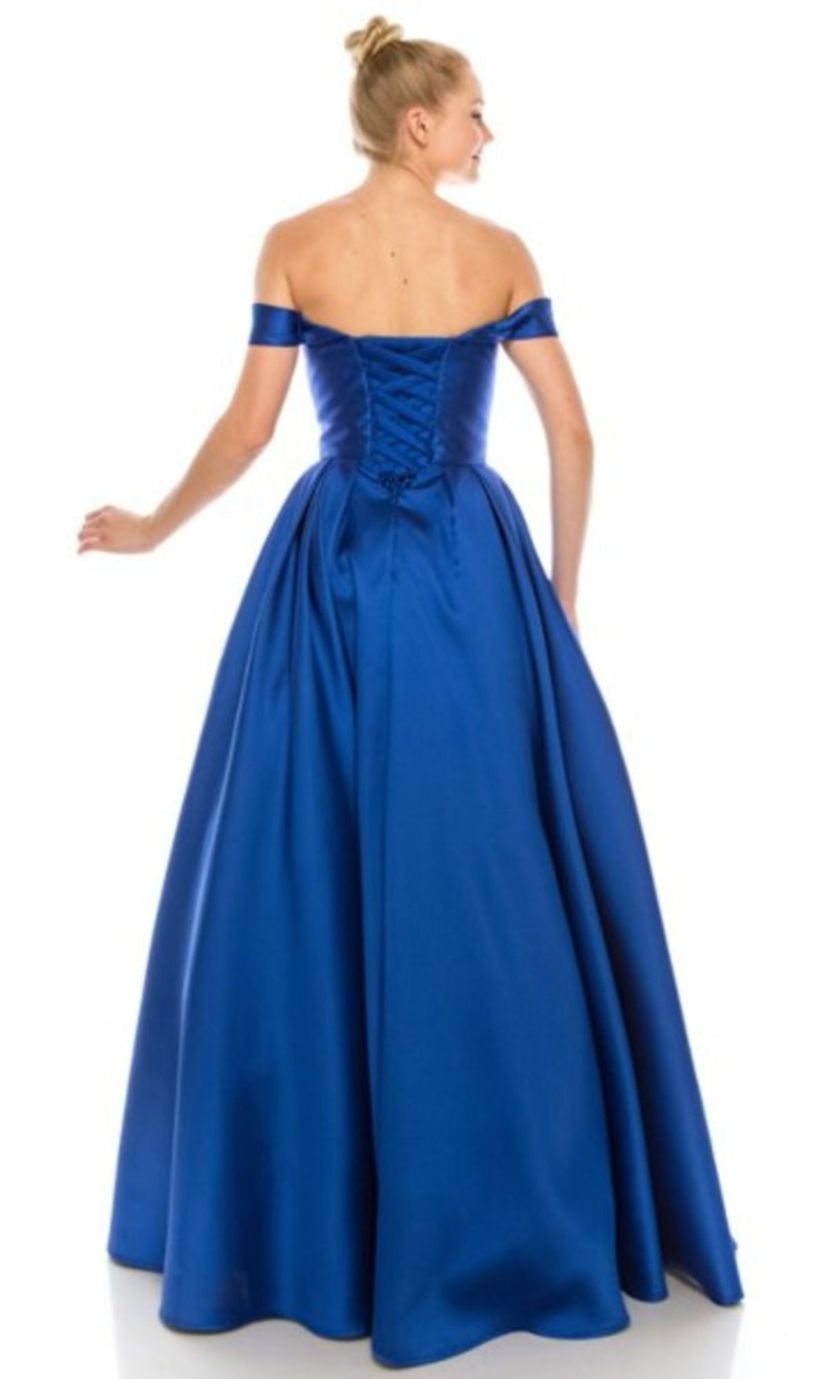 A woman faces away, wearing the Chicas C9197 Off-the-Shoulder Long Prom Ball Gown in royal blue with a fitted lace-up back.