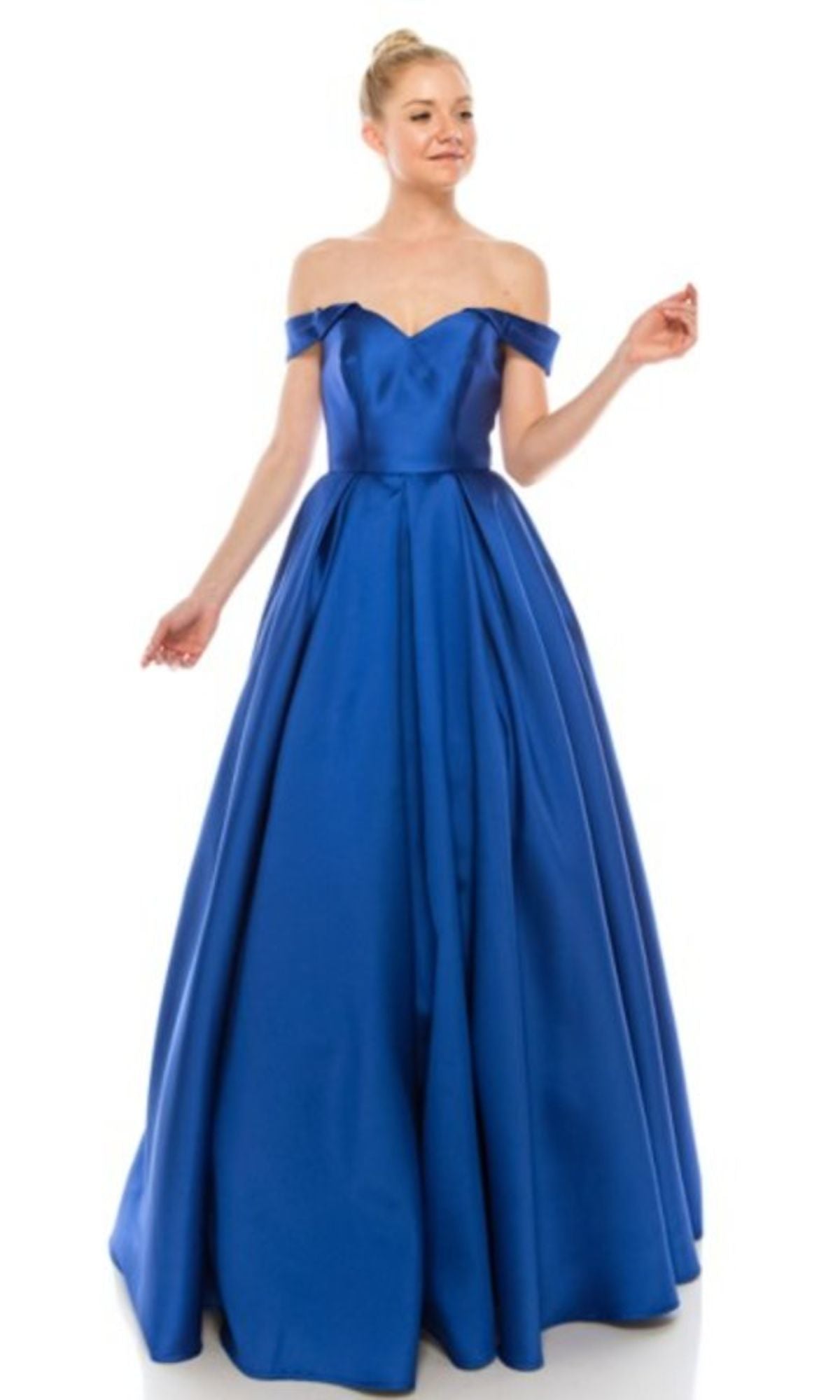 A woman in the Chicas C9197 Off-the-Shoulder Long Prom Ball Gown stands against a plain white background.