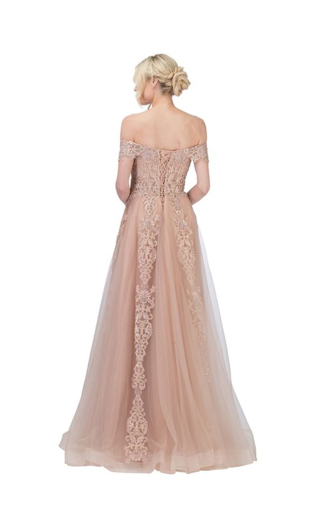 A woman models the Long Lace Prom Ball Gown: Chicas CA1103 in blush pink, featuring an off-the-shoulder lace design with delicate detailing, viewed from the back against a white background.