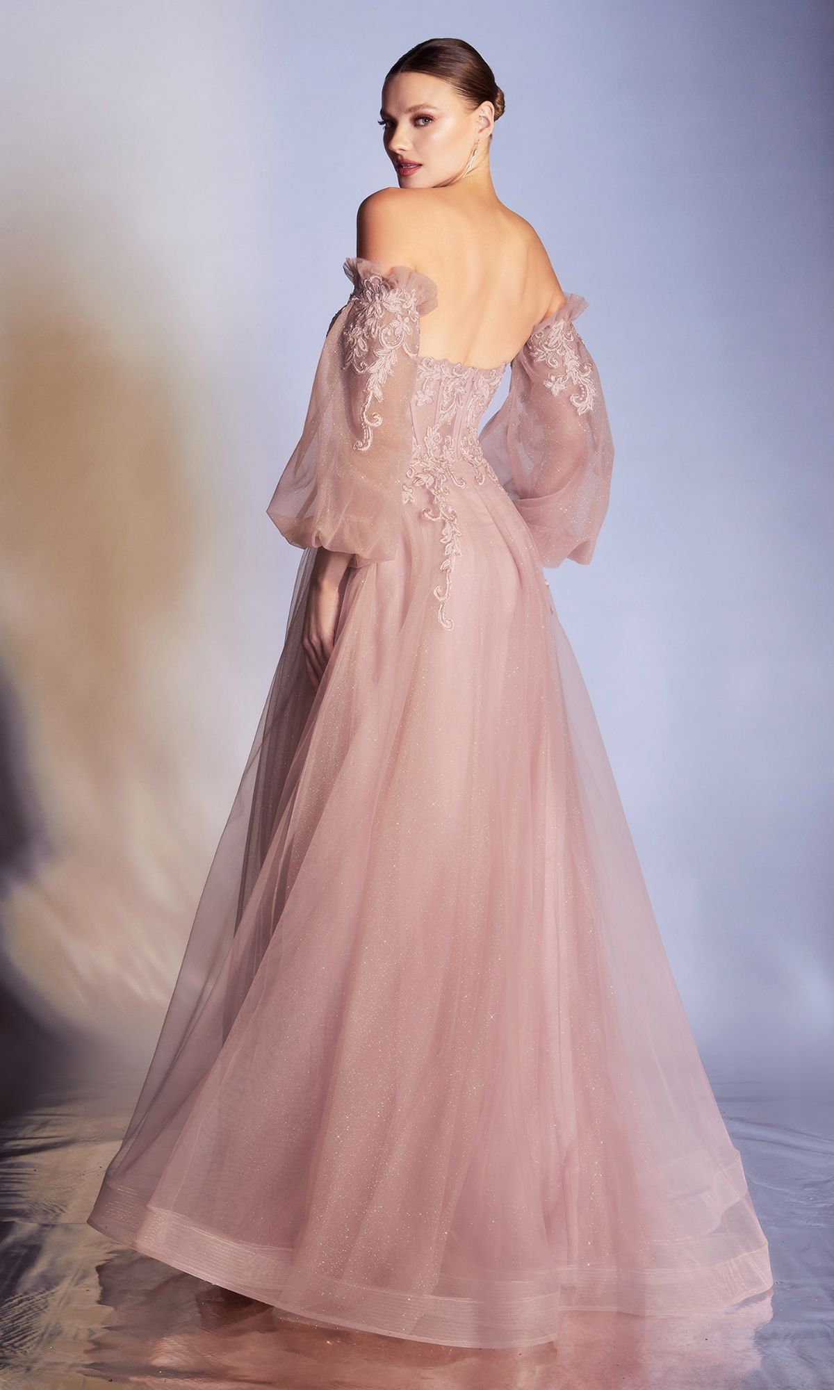 A woman shines in the Strapless Puff-Sleeve Long Prom Dress CD948, featuring a sweetheart neckline, removable puff sleeves, and a stunning pink hue.