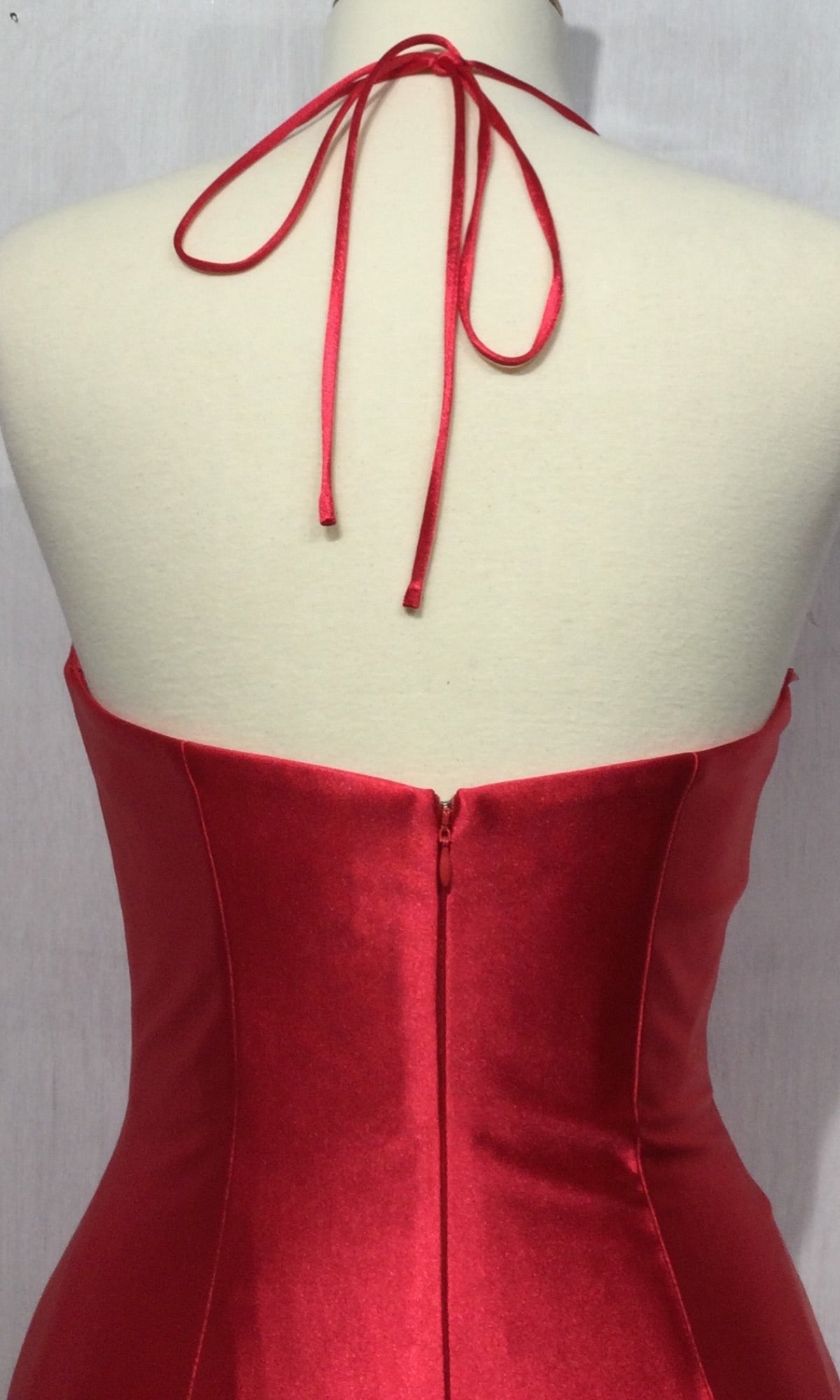 Back view of the Long Satin Halter Prom Dress with Corset CH112 on a mannequin, showing a tied halter strap and visible center zipper—an elegant and budget-friendly prom dress choice.
