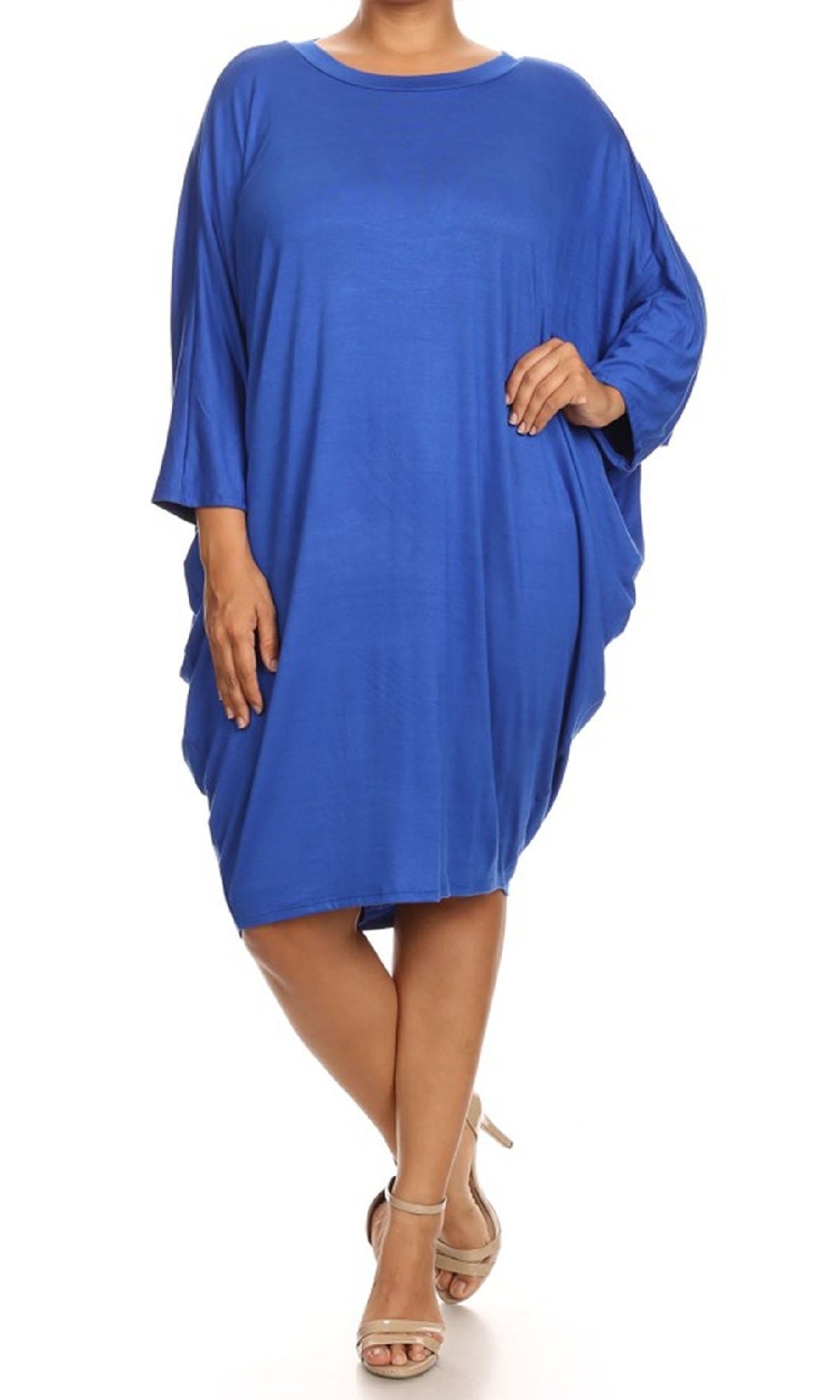 A woman stands against a white background wearing the Short Casual Plus Size Dress with Dolman Sleeves in royal blue and beige strappy heels.