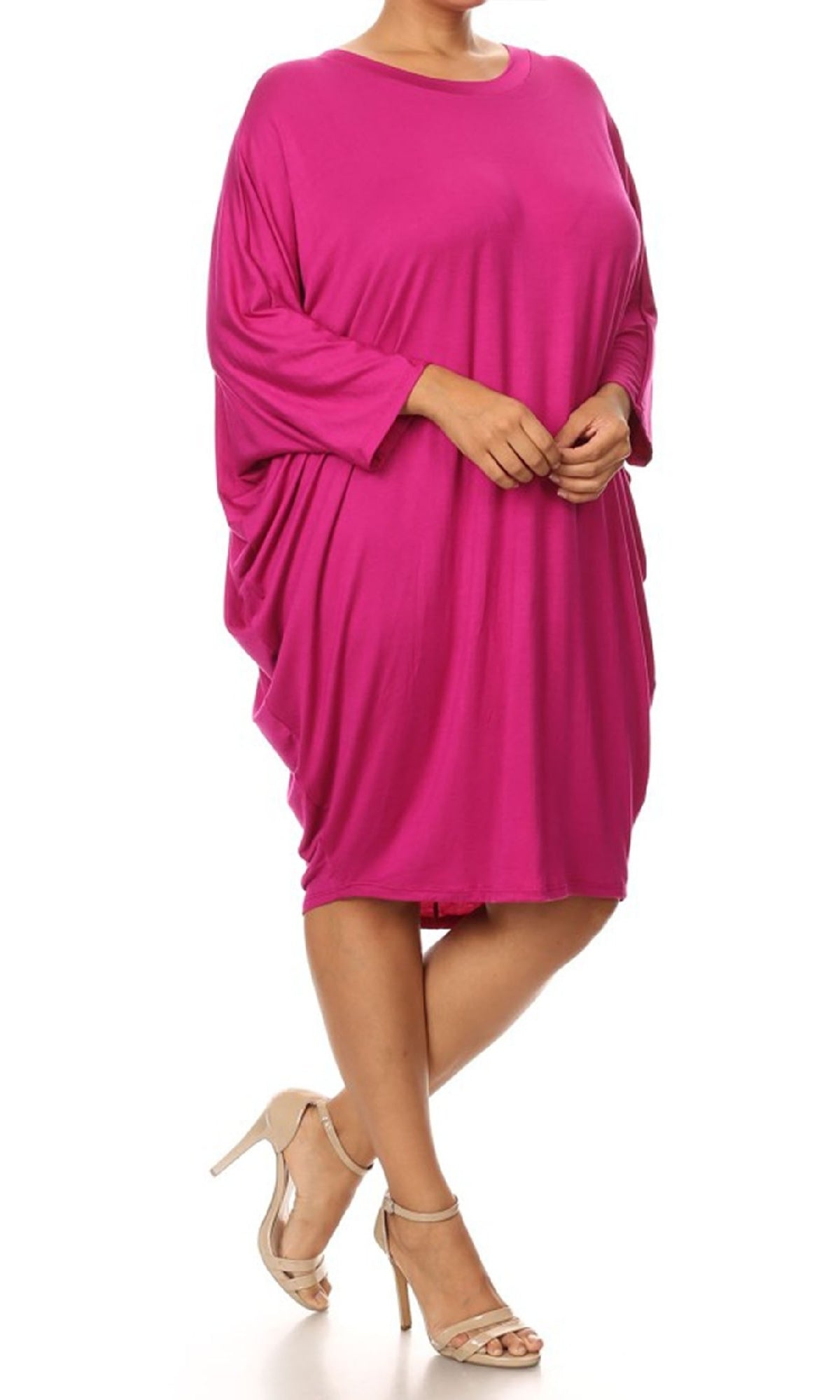 A person wears a loose-fitting, bright pink Short Casual Plus Size Dress with Dolman Sleeves and beige high-heeled sandals, standing against a white background.