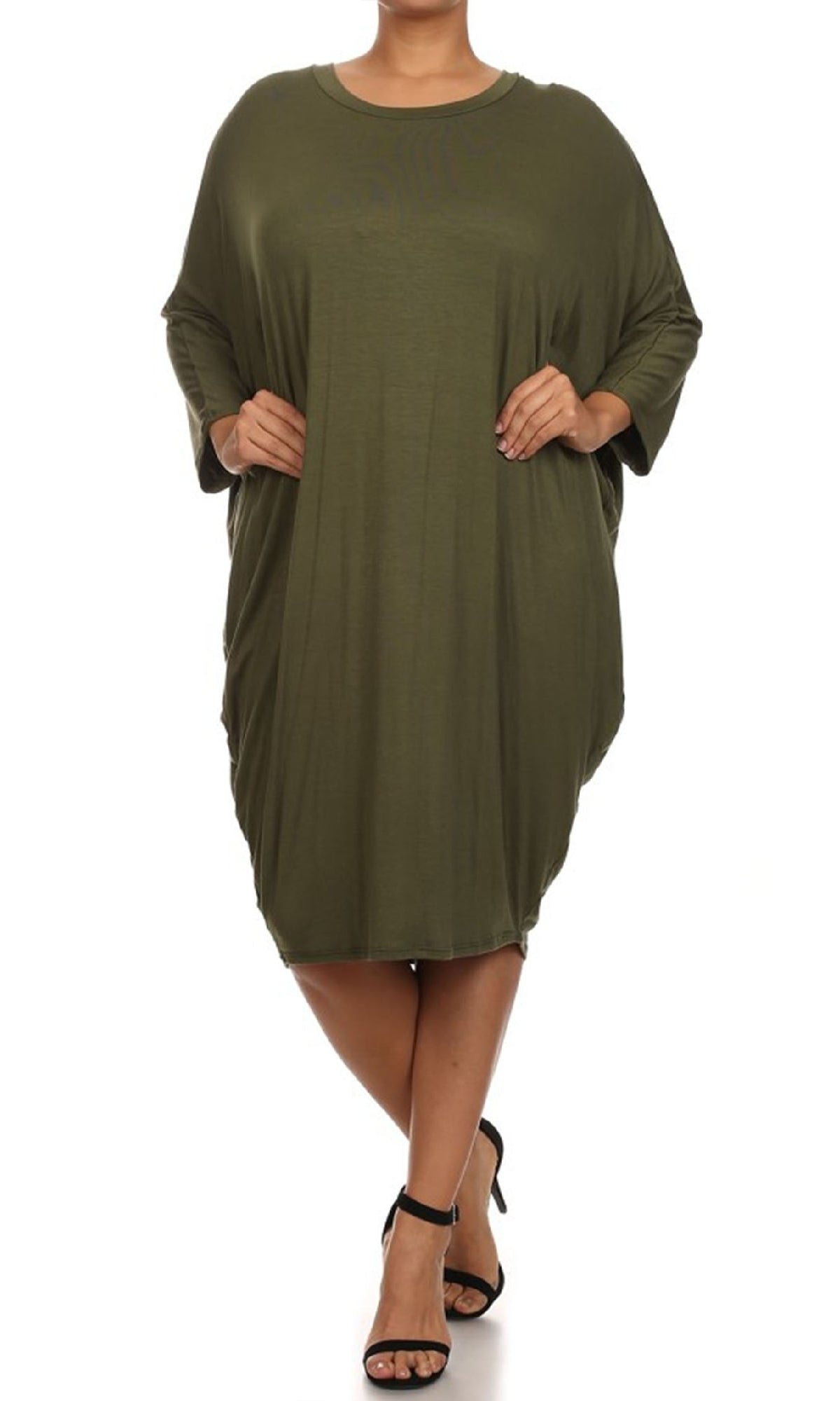 A woman models the Short Casual Plus Size Dress with Dolman Sleeves, an oversized olive green knee-length everyday style, paired with black open-toe heels against a white background.