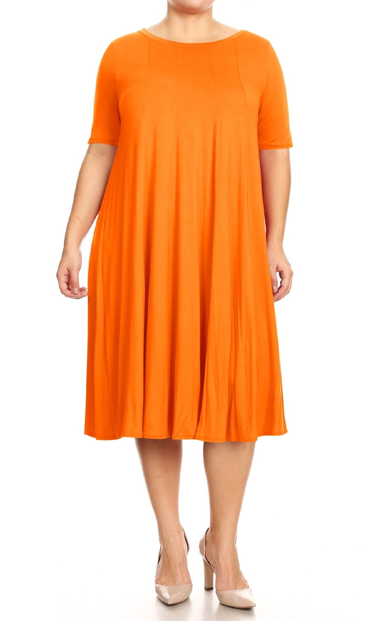 A person wearing the Plus-Size Jersey Knit Oversized A-Line Casual Dress in orange with beige heels stands against a plain white background.