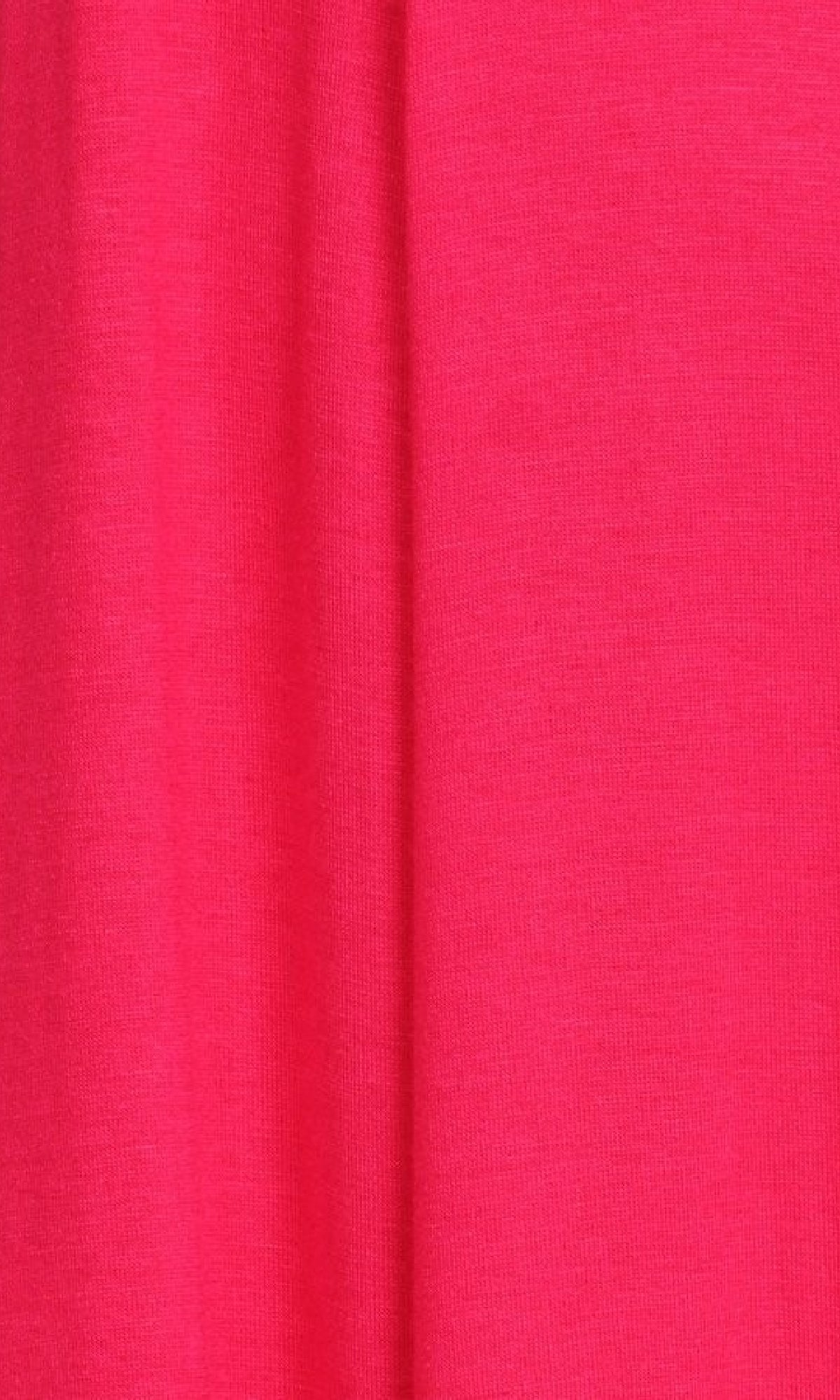 A close-up of bright pink, textured fabric with a vertical fold from the Short Sleeve Casual Oversized Jersey Knit Dress.