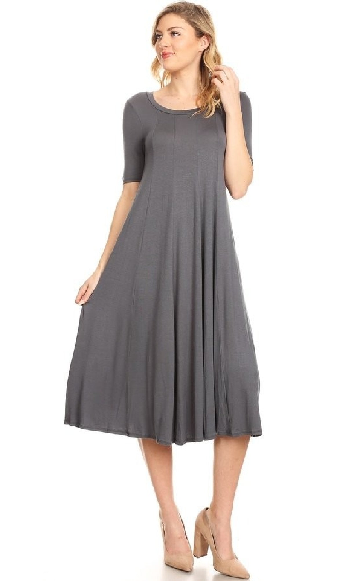 A woman poses against a white background wearing the Short Sleeve Casual Oversized Jersey Knit Dress in grey with beige heels.