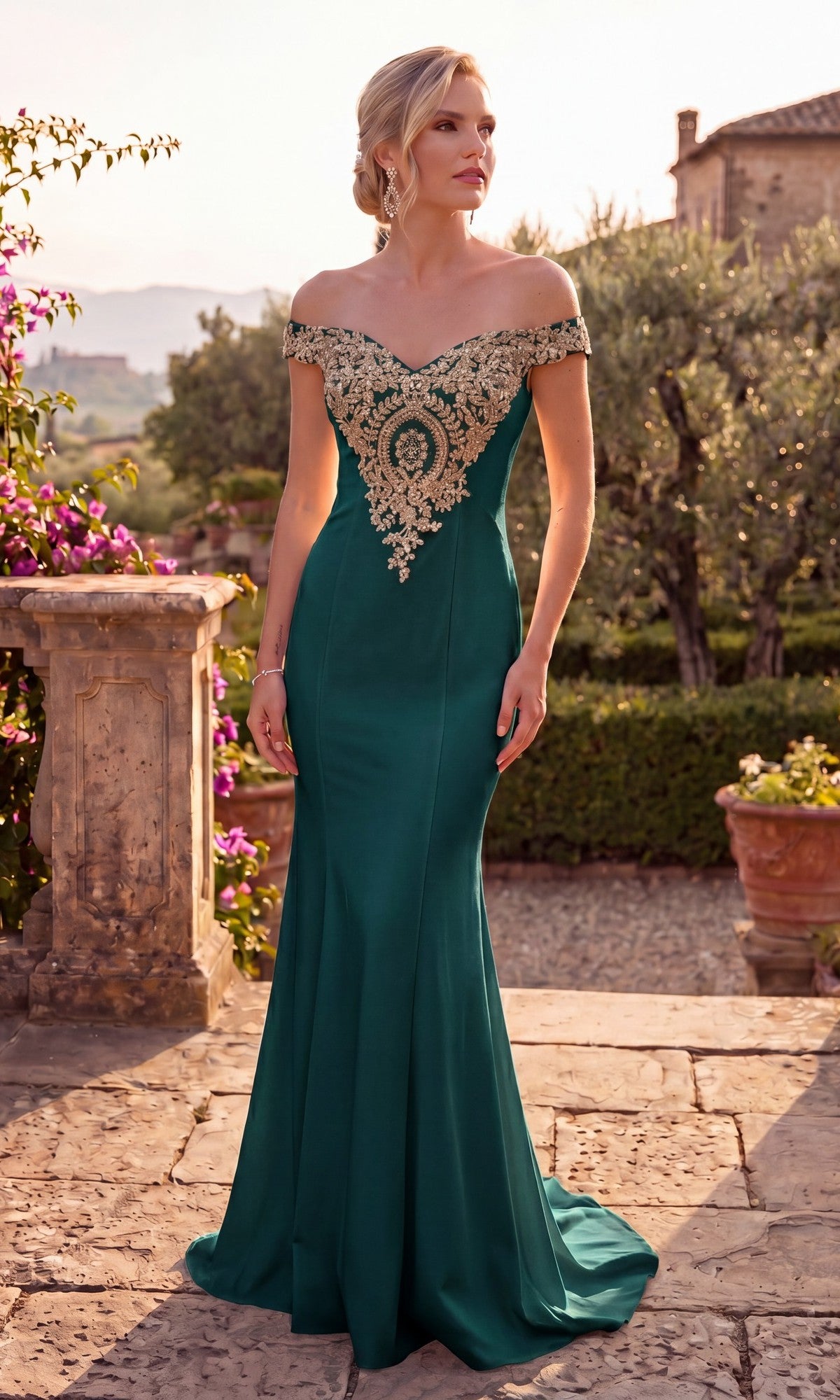 A woman stands outdoors on a stone patio surrounded by lush greenery, wearing the Long Formal Dress: Chicas DM4011 in green, featuring an off-shoulder design with an embroidered bodice and gold appliques.