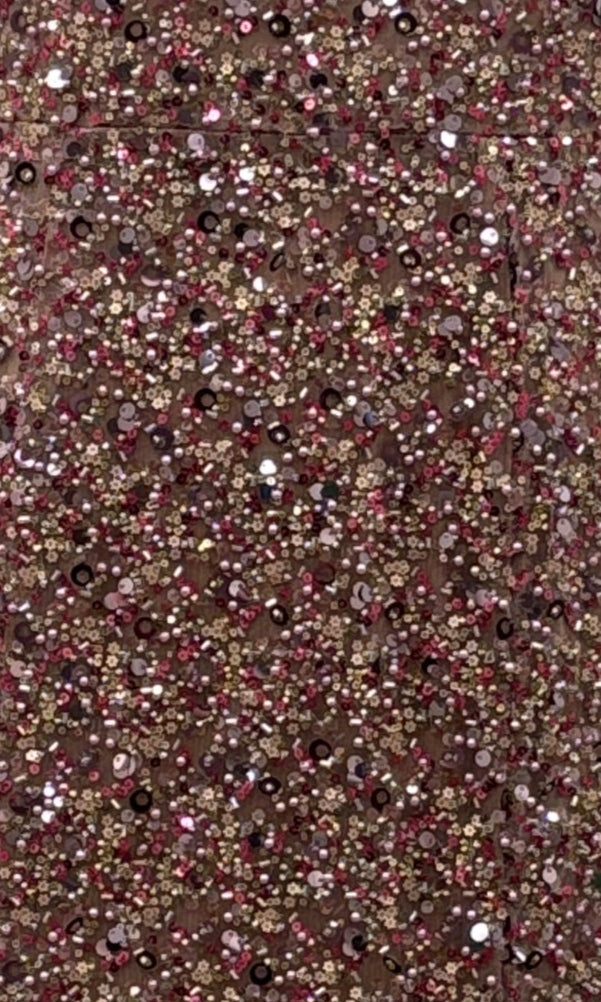 Close-up of the Portia and Scarlett PS25615E Long Prom Dress, featuring a dense layer of pink, gold, and silver sequins for a sparkling, textured look—ideal for formal events.