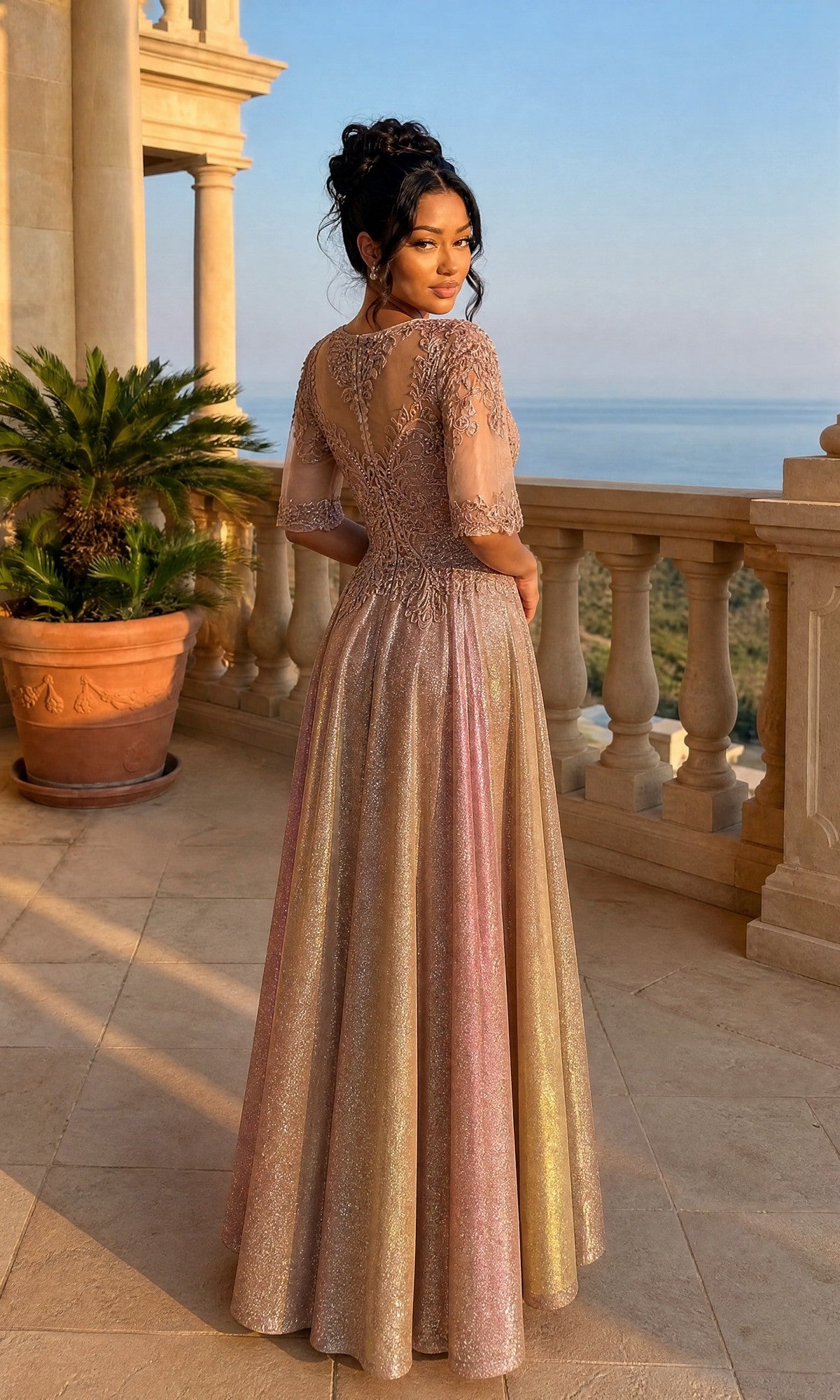 A woman in the Long Formal Dress: Chicas J006 stands with her back to the camera on a stone balcony overlooking the ocean.