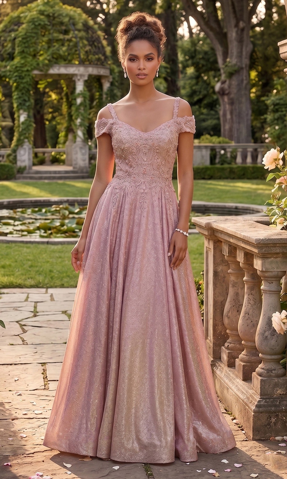 A woman wearing the Long Prom Dress: Chicas J169 in rose gold, featuring an off-the-shoulder style and a floor-length glitter a-line skirt, stands on a stone path in a garden surrounded by lush greenery and architectural stonework.