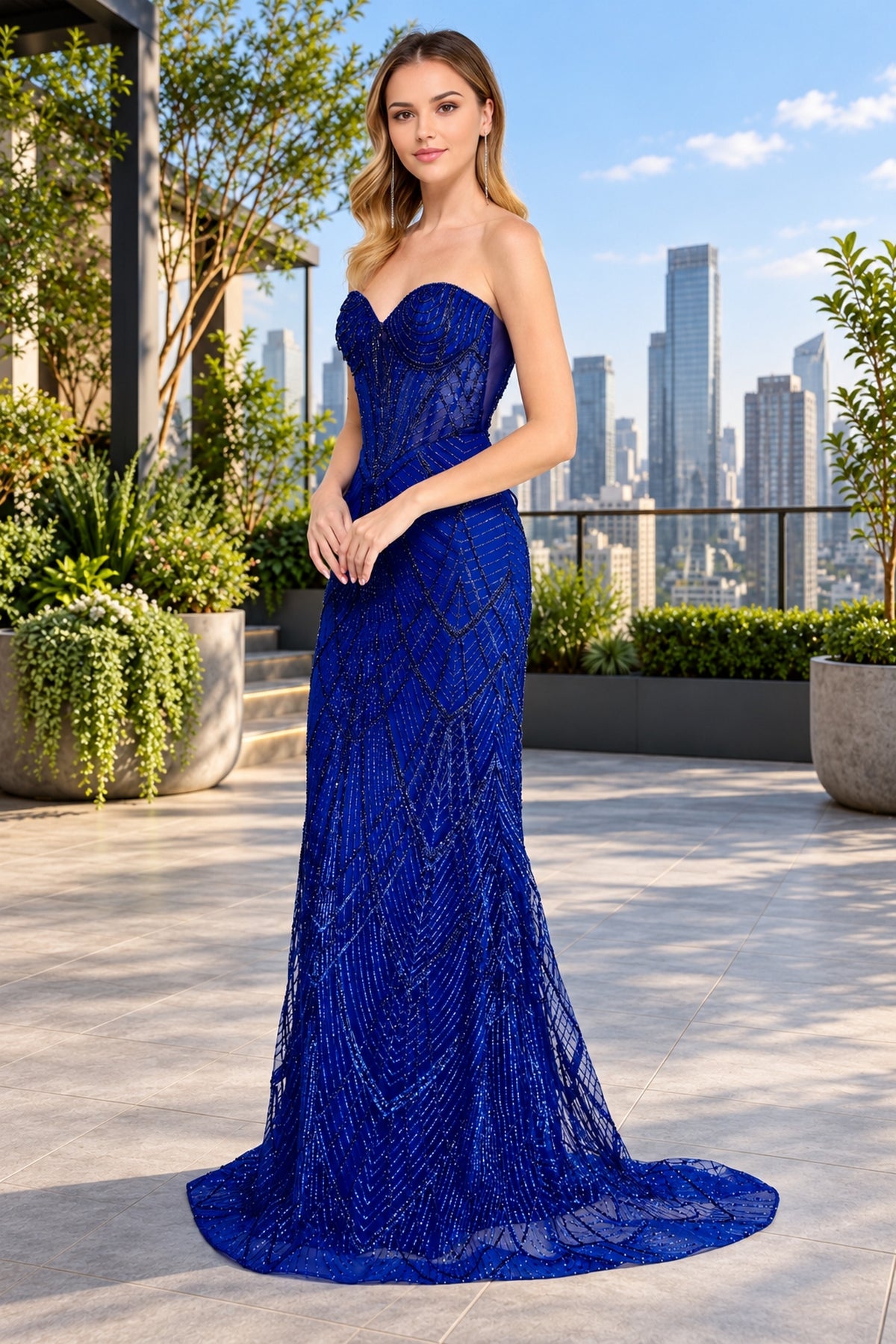 The Long Prom Dress: Amelia Couture JQ1107 is a strapless, floor-length royal blue gown featuring a sweetheart neckline, all-over sequin geometric detailing, a fitted corset bodice, and a subtle train.