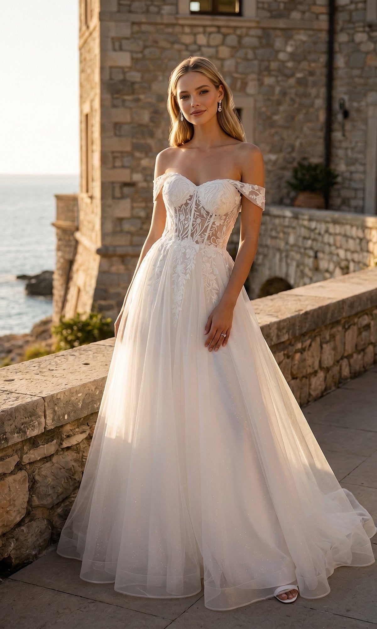 Long Off-White Bridal Dress: Juliet 82606L featuring an off-the-shoulder neckline, structured corset bodice, and full tulle A-line skirt.
