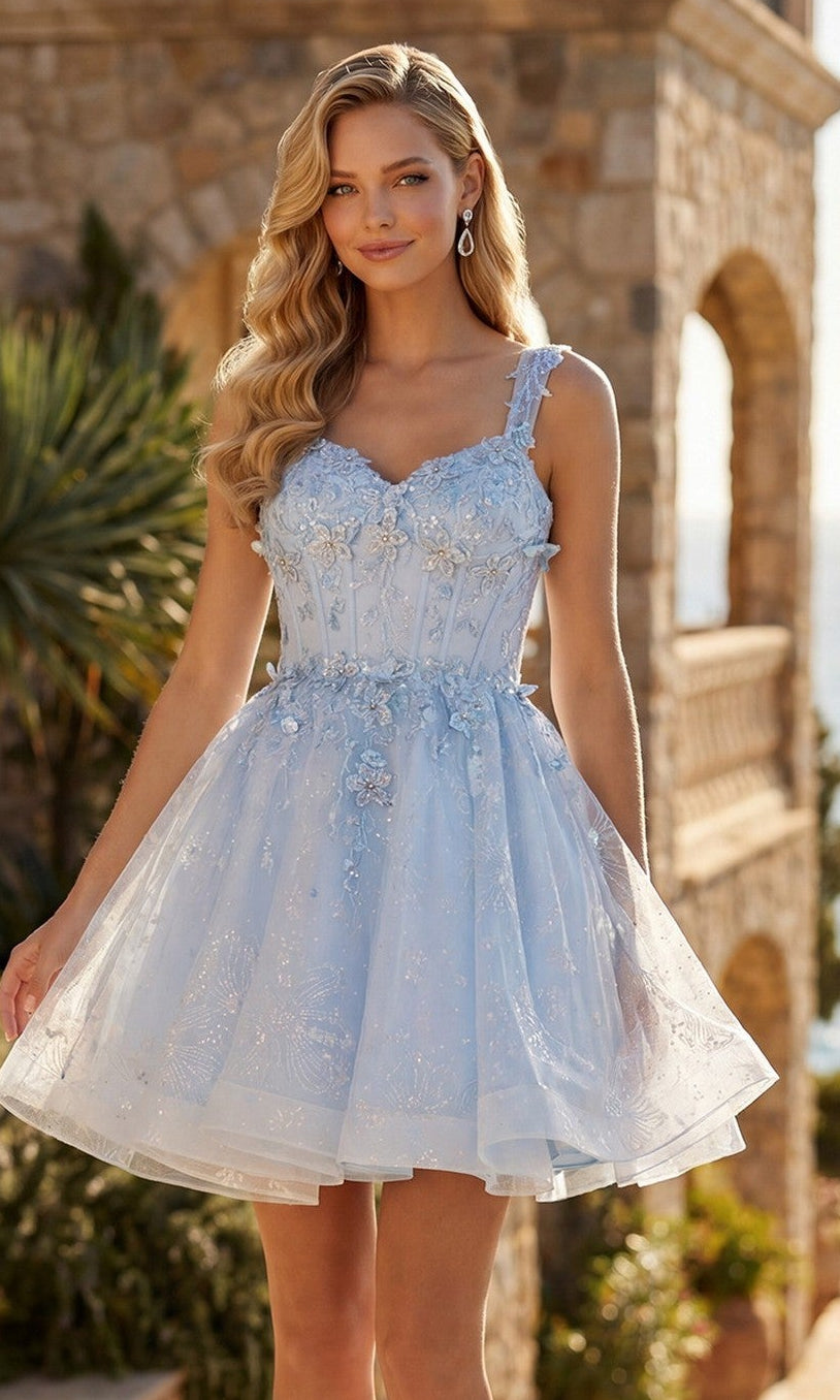 A woman stands outdoors in sunlight, wearing the Short Pastel A-Line Hoco Dress: Juliet JT976L with a full skirt, lace details, and a corset back, paired with strappy high-heeled sandals.