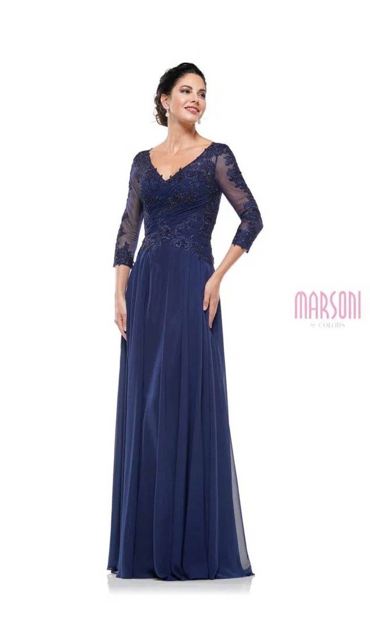 A woman in the Marsoni M237 Long Formal Dress, navy color, featuring an A-line silhouette with a lace applique bodice and three-quarter sleeves, stands against a white background.