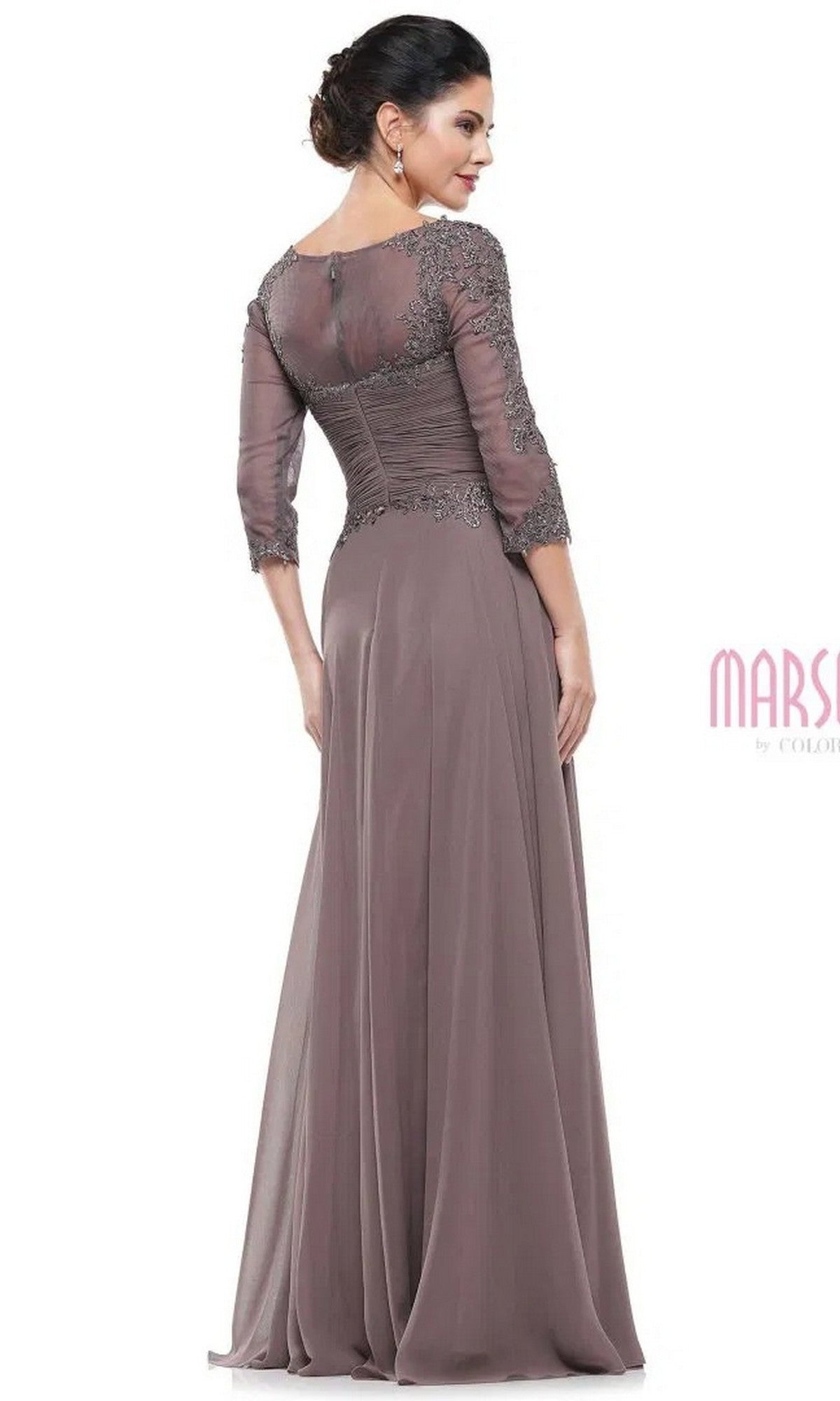 A woman stands with her back to the camera, wearing the Marsoni M237 long formal dress featuring a mauve A-line silhouette, lace applique bodice, and three-quarter sleeves.