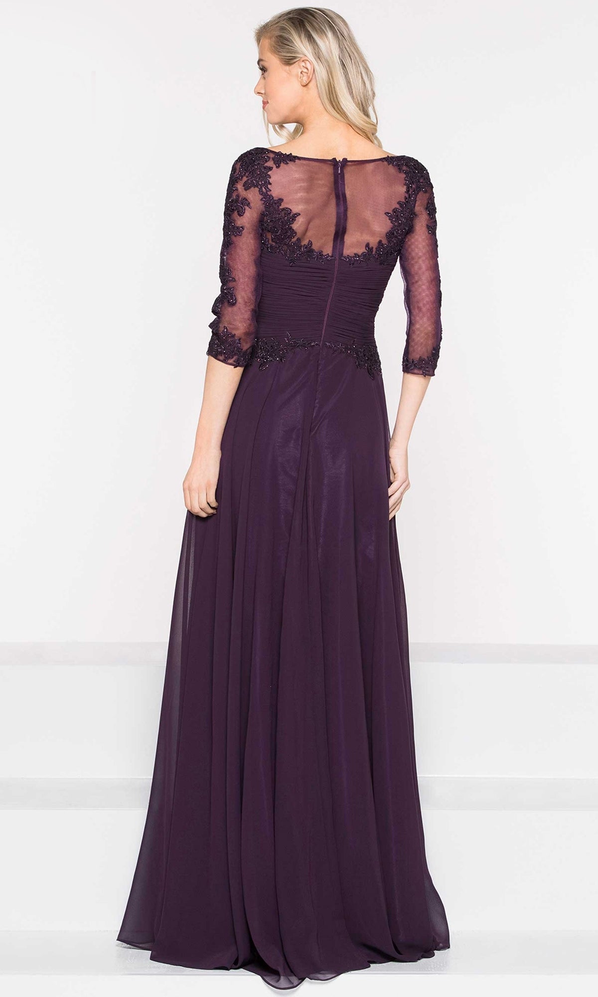 Woman wearing the Long Sleeve Long A-Line Formal Dress: Marsoni M237 stands with her back to the camera against a plain white background.
