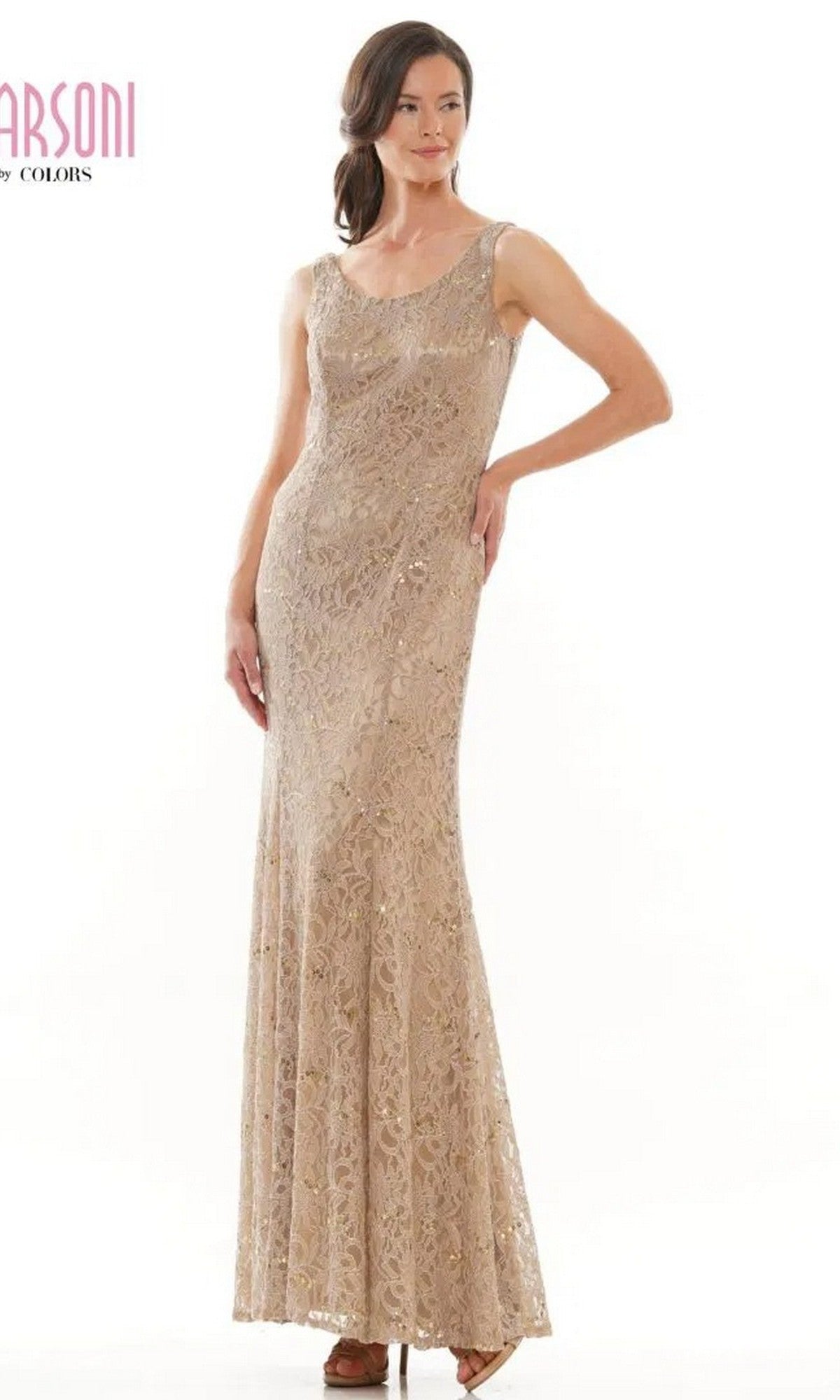 A woman in the Marsoni M301 long formal dress, featuring a sleeveless lace design in beige, stands confidently against a plain background, radiating timeless elegance.