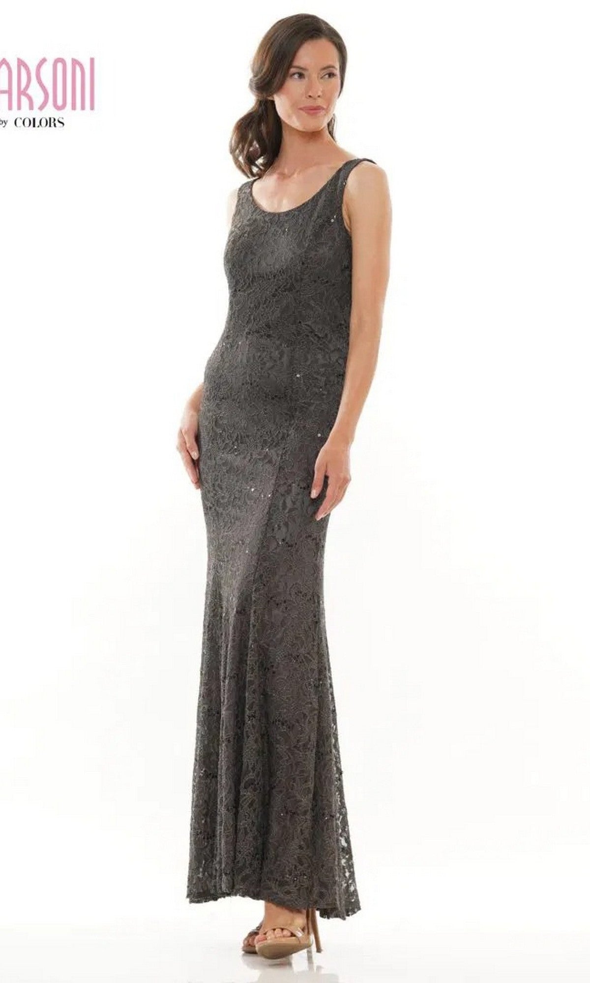 A woman poses elegantly against a plain white background, wearing the Marsoni M301 Long Formal Dress—a sleeveless lace evening gown with a scoop neckline.
