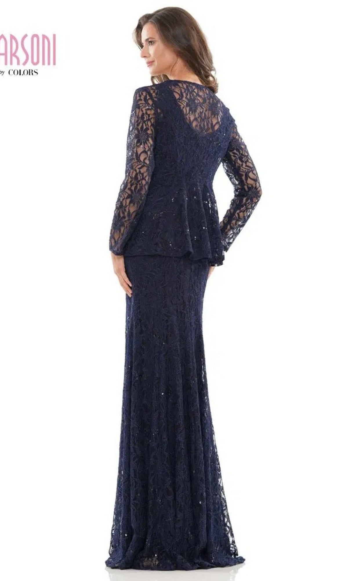 A woman faces away, wearing the Marsoni M301—a long, formal navy blue lace dress featuring long sleeves and a flared hem.
