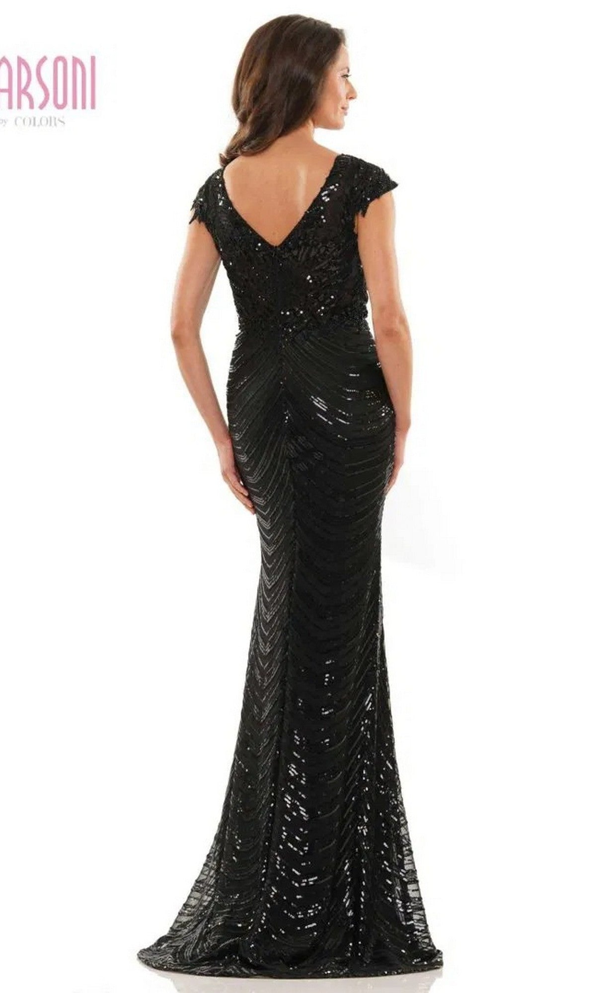A woman in the Marsoni M315, a black, floor-length formal dress with sequin beadwork, cap sleeves, and a deep V-back, stands facing away.