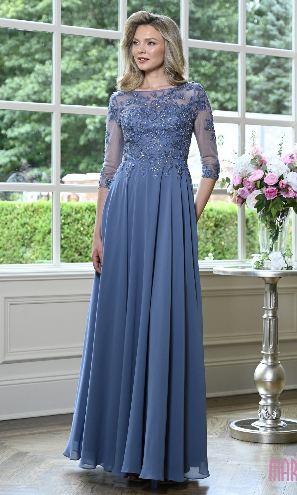 Modest Formal Dress: Marsoni M361 in slate blue, featuring a beaded lace bodice, sheer three-quarter sleeves, and a floor-length A-line skirt.