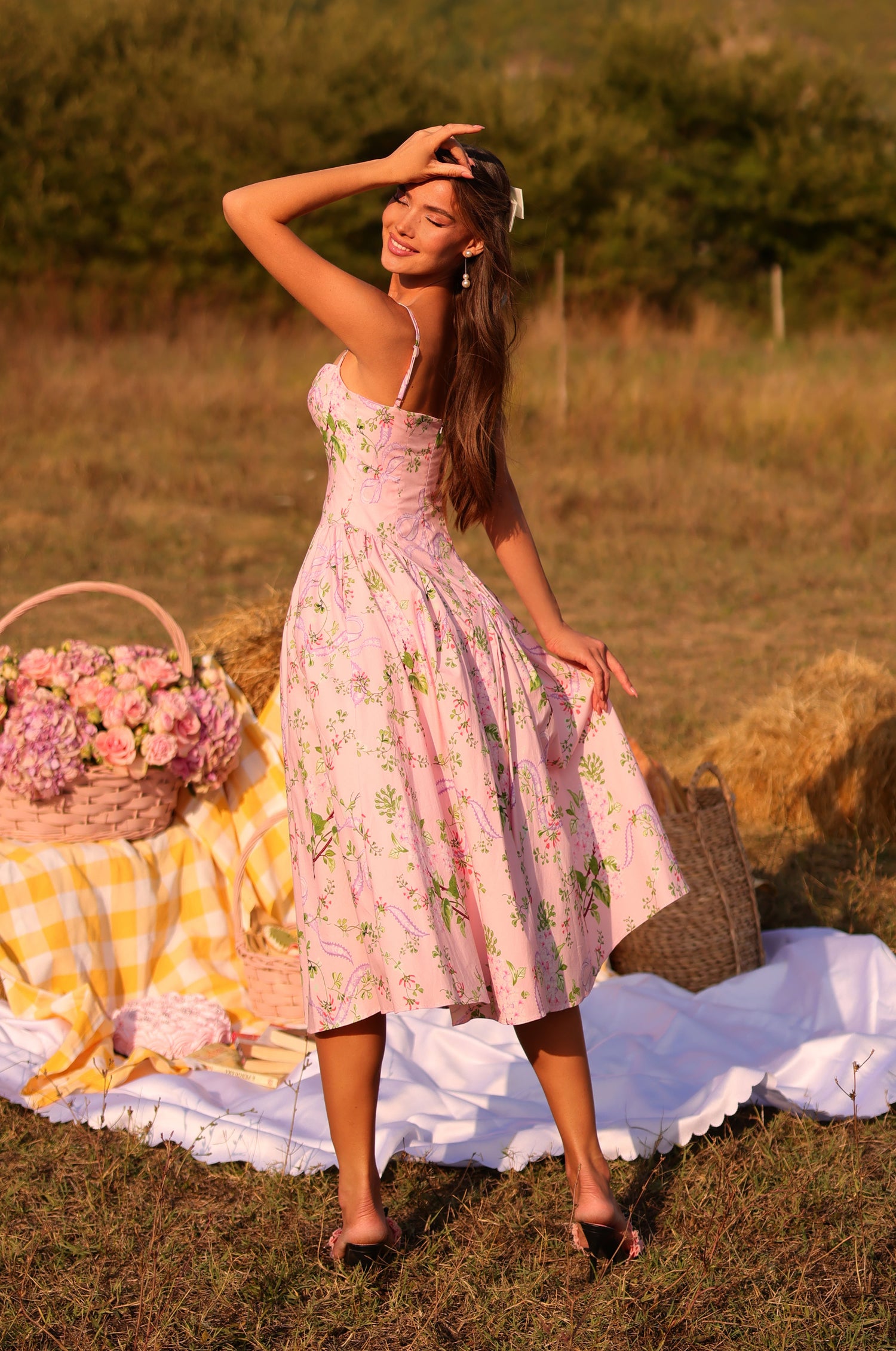 Blush pink floral corset midi dress with spaghetti straps