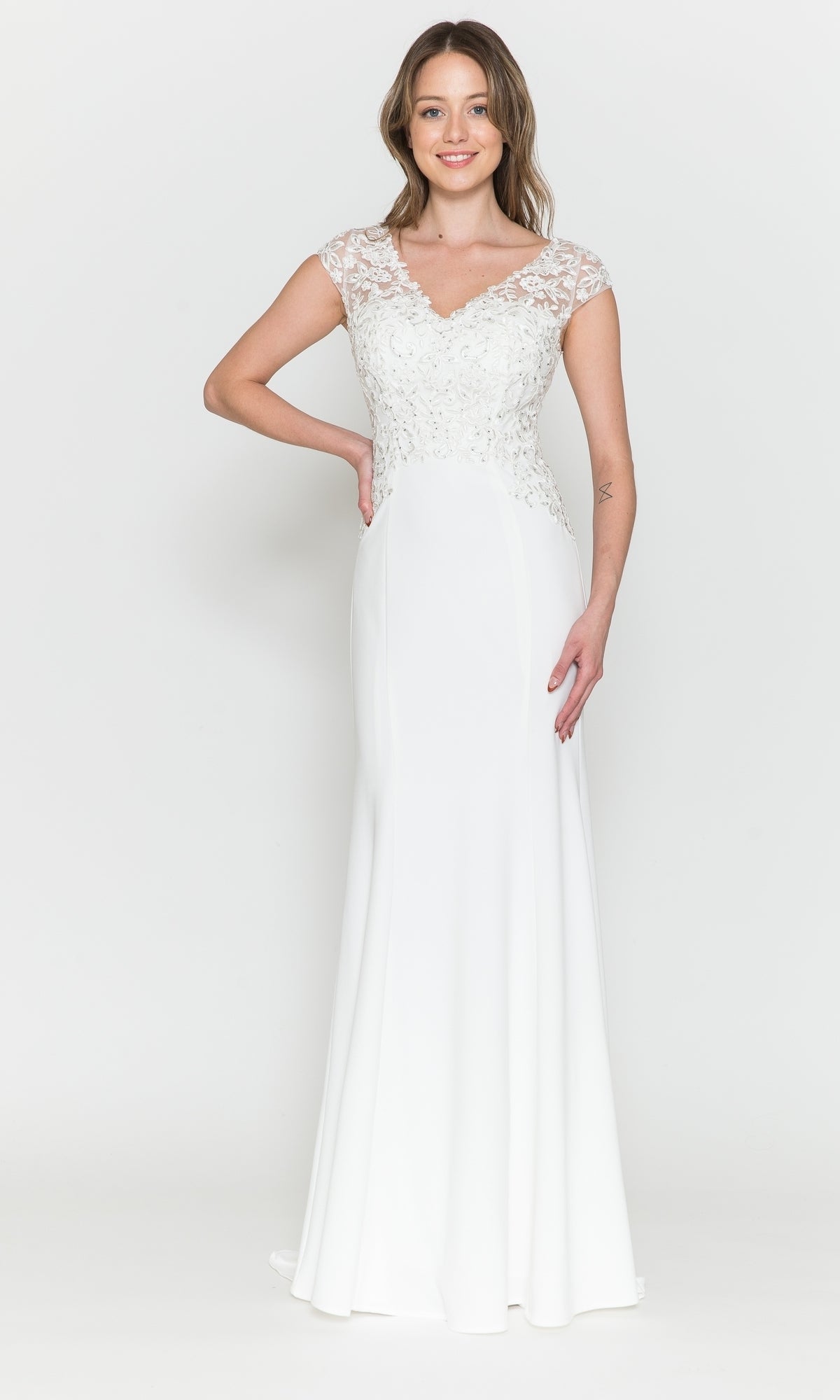 A woman poses against a white background in the Cap-Sleeve Embroidered Jersey Long Prom Dress 8558, showcasing its lace cap sleeves, fitted bodice, and floor-length embroidered design.