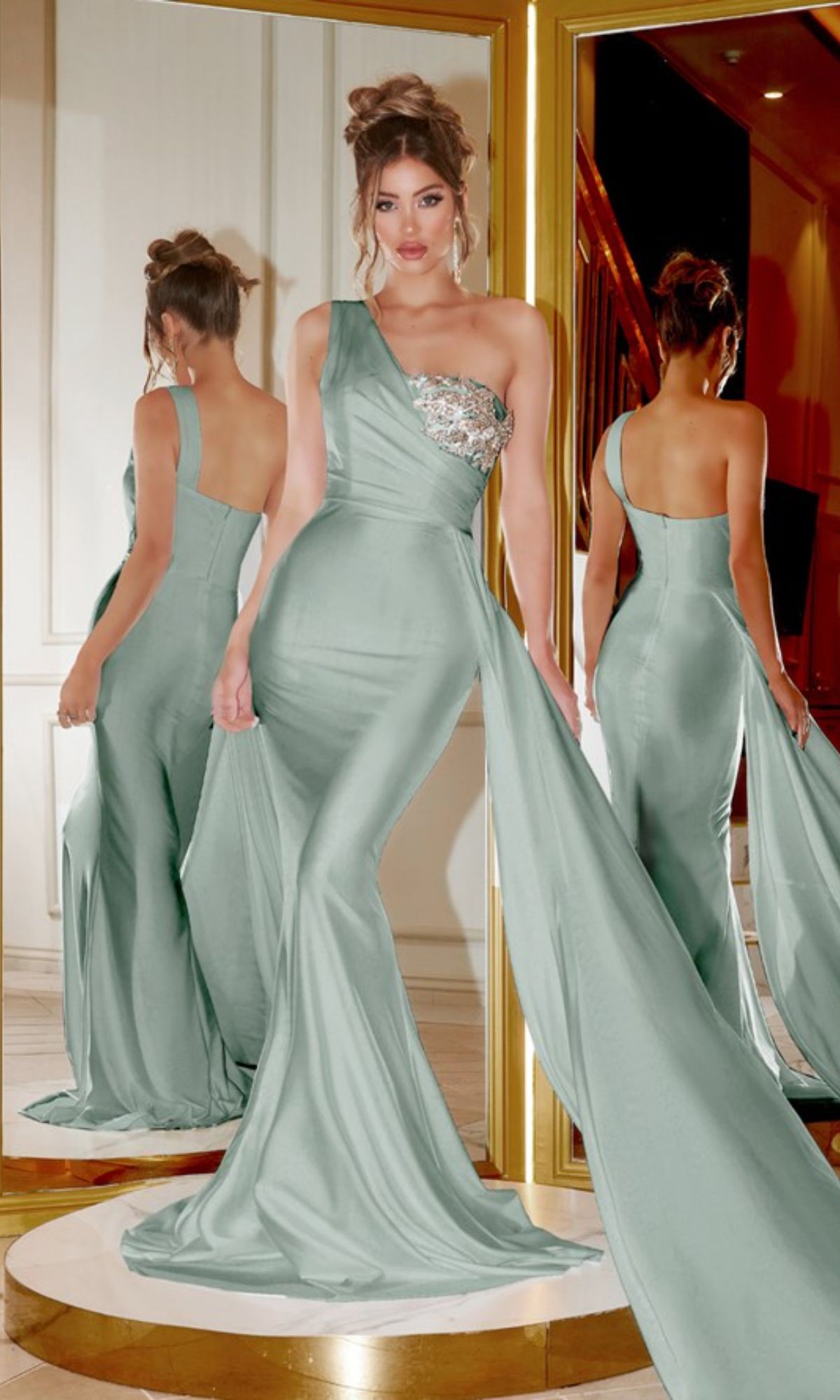 A woman in an olive Long Formal Dress PS21219 by Portia and Scarlett stands before mirrors, displaying both the front and back of the elegant one shoulder gown with a long train.
