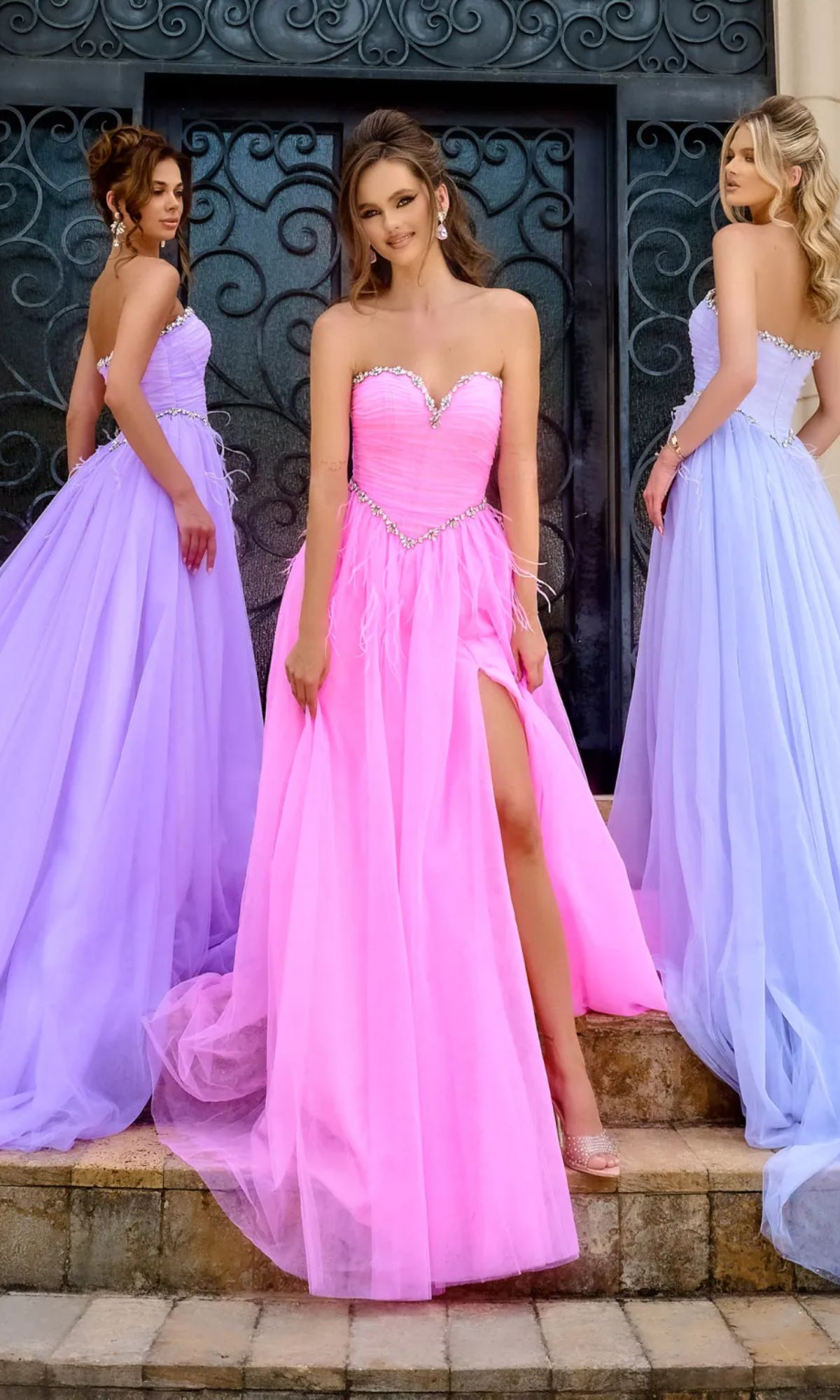 Three women pose outdoors in strapless, floor-length gowns; the central woman wears a striking bright pink Long Prom Dress PS24632 by Portia and Scarlett with a beaded sweetheart neckline, while the others wear light purple strapless dresses.