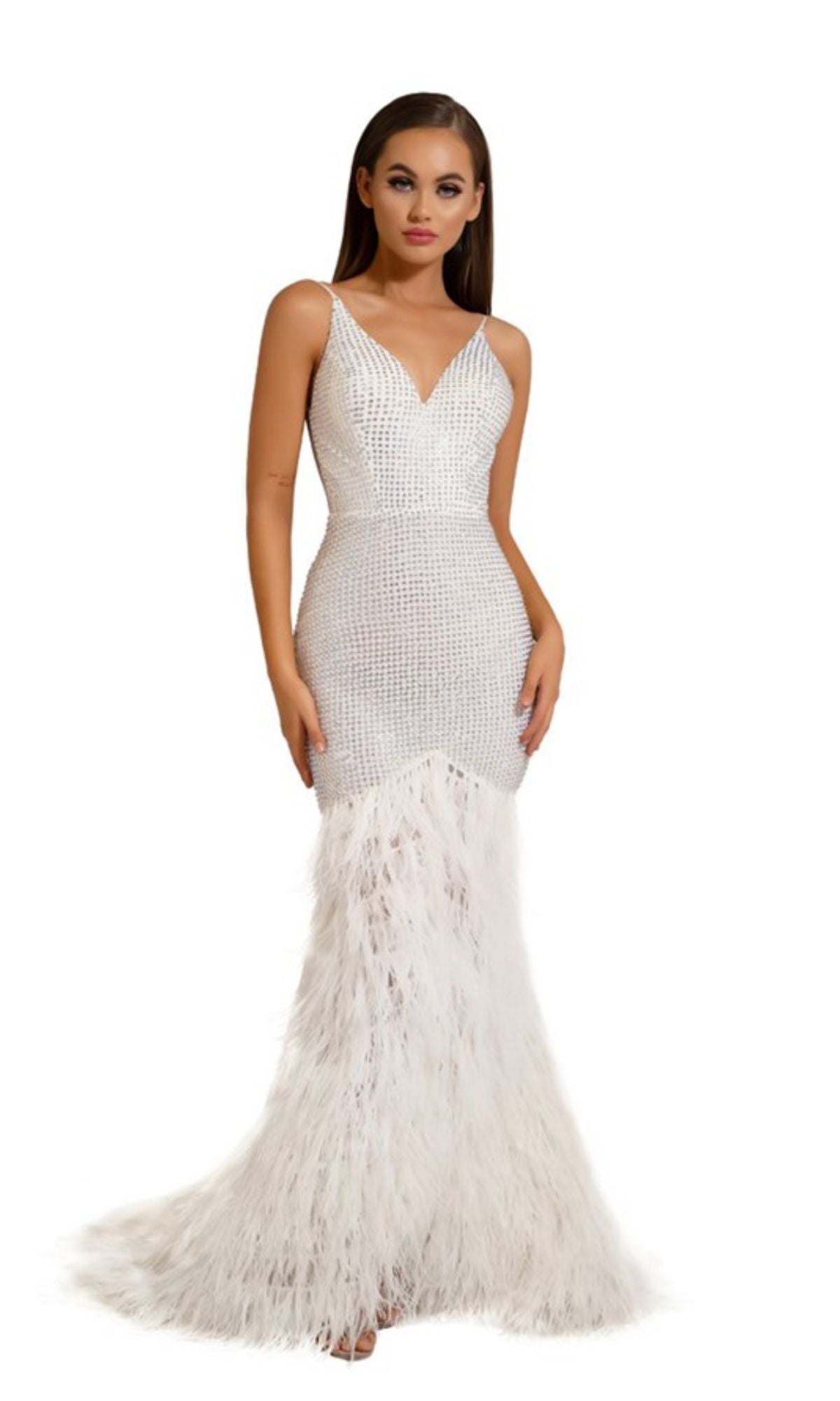 A woman models the Portia and Scarlett Long Formal Dress PS6826—a sleeveless, form-fitting mermaid gown with a deep V-neckline and feather-trim skirt—standing against a white background.
