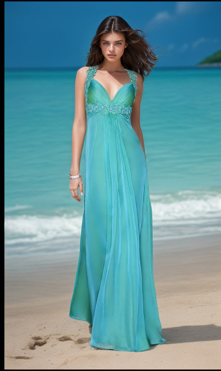 A woman in the La Femme Empire-Waist Ruched Chiffon Prom Dress 20134, a turquoise floor-length gown with an open back, stands on a sandy beach with turquoise ocean water in the background.