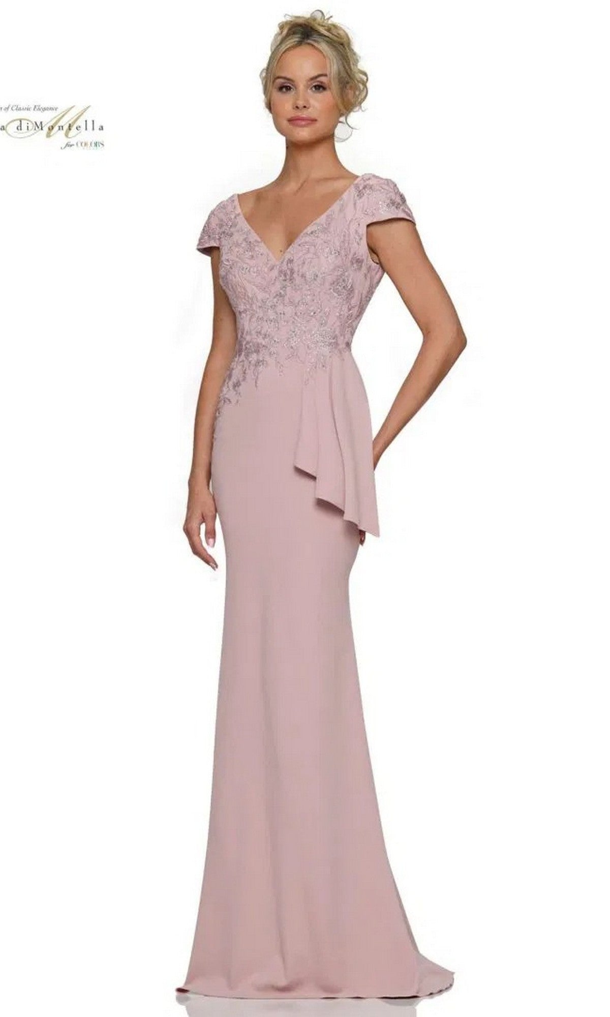 A woman wearing the Rina Di Montella RD2960 long formal dress in rose, featuring short sleeves, an embroidered bodice, and a side drape, stands against a white background.