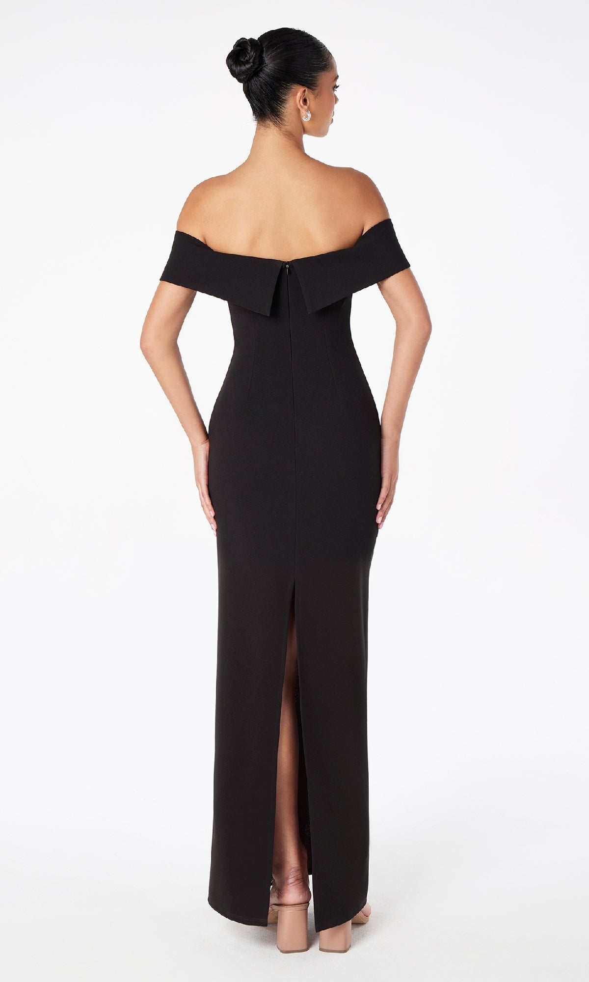 A woman models the Off-the-Shoulder Long Prom Dress: Astee T2011, featuring a back slit, as she stands against a white background with her back facing the camera.