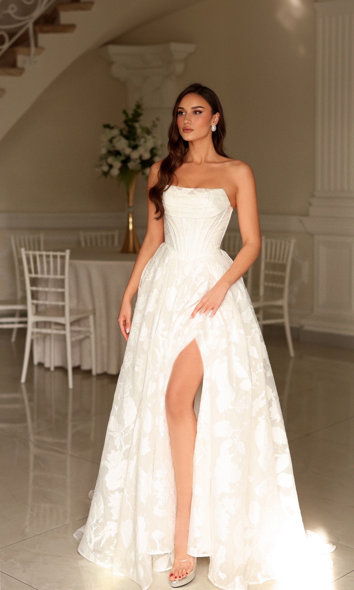 Tina Holly TW623 off-white strapless floral wedding dress with a fitted bodice and a full, floor-length A-line skirt featuring a high leg slit.