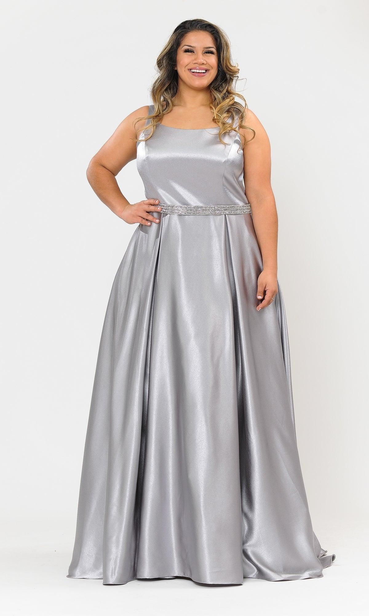 A woman stands smiling against a white background, wearing the Sleeveless Plus-Size Long Belted Prom Dress W1010, featuring a square neckline and embellished waistband.