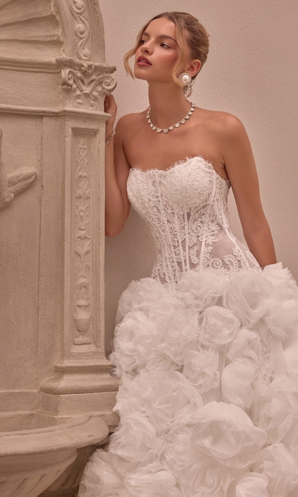 Strapless Andrea & Leo WL092 wedding dress featuring a lace-up corset bodice and a voluminous 3D rosette ball gown skirt.