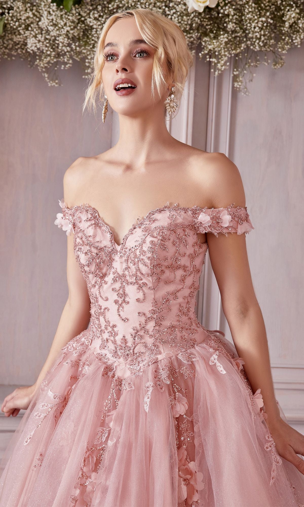 A woman stands indoors, smiling and looking upward in the Off-Shoulder Long Sweetheart Prom Ball Gown CD0185 adorned with floral-lace appliques.