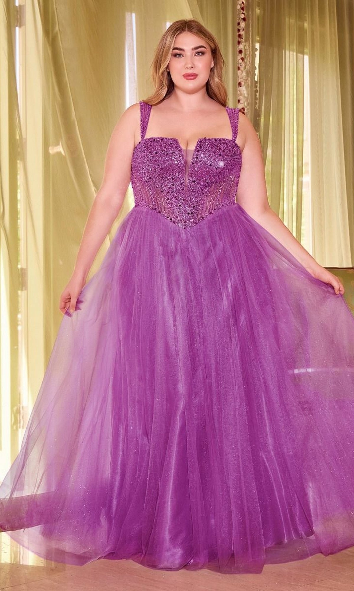 A woman shines in the Plus-Size Sequin-Bodice Long Prom Dress CD0217C—an eye-catching purple gown with a sparkling sequin bodice.